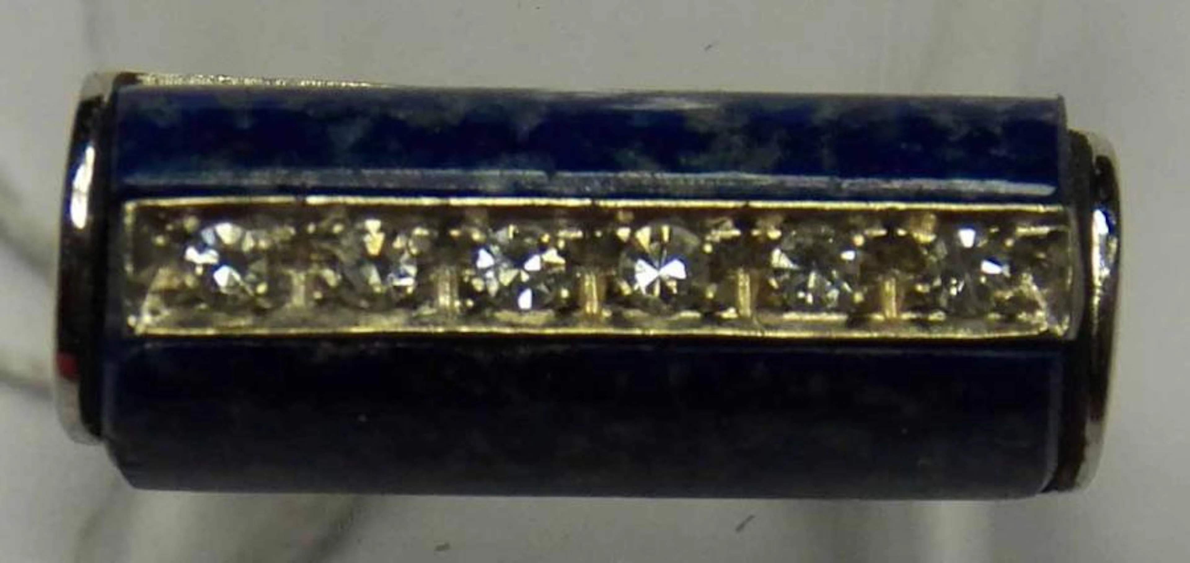 Bague rouleau en or gris ornée de sodalite et d'une ligne de brillants