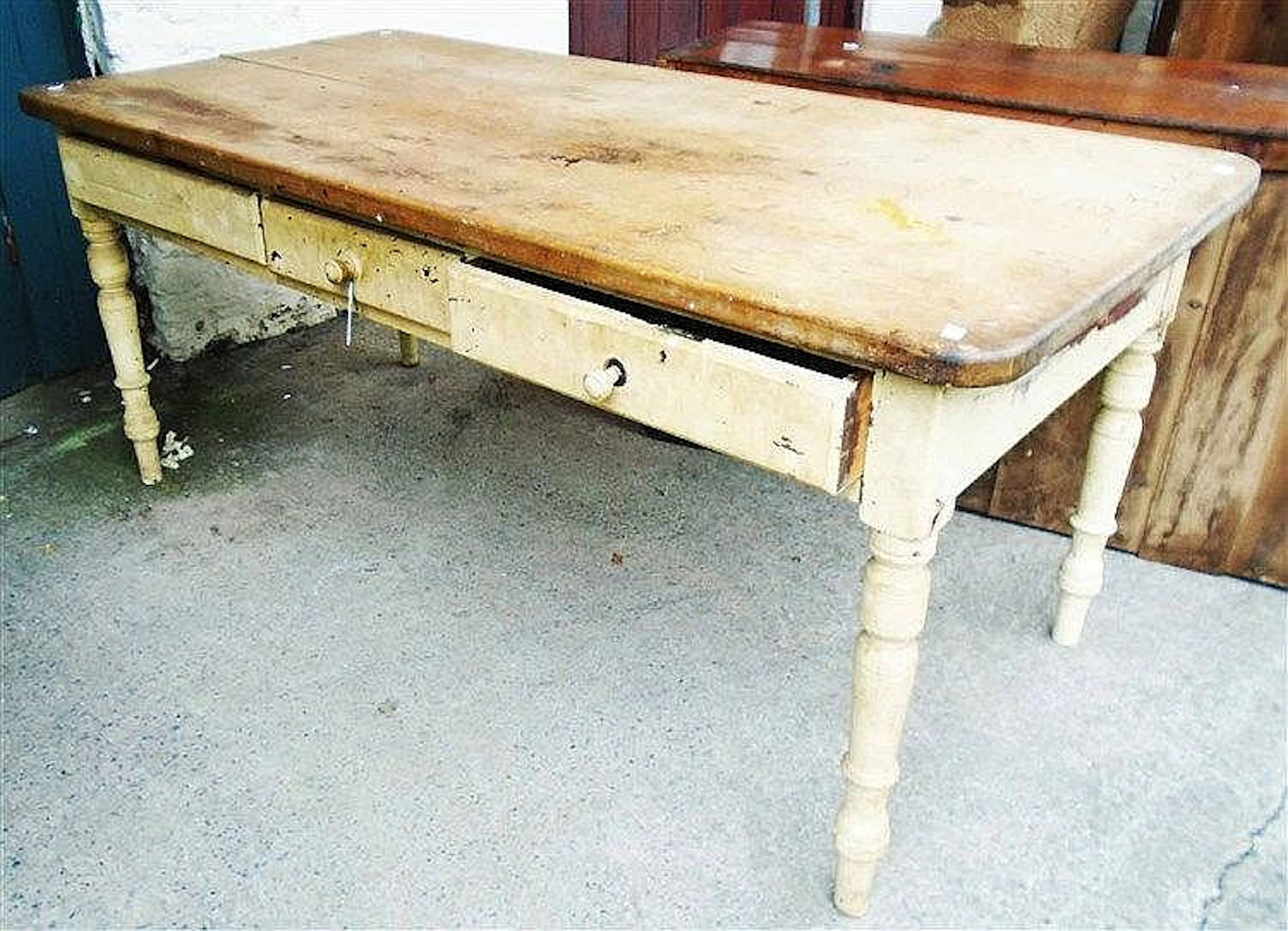 A 6' late 19th Century pine scrub top farmhouse kitchen table with three fr