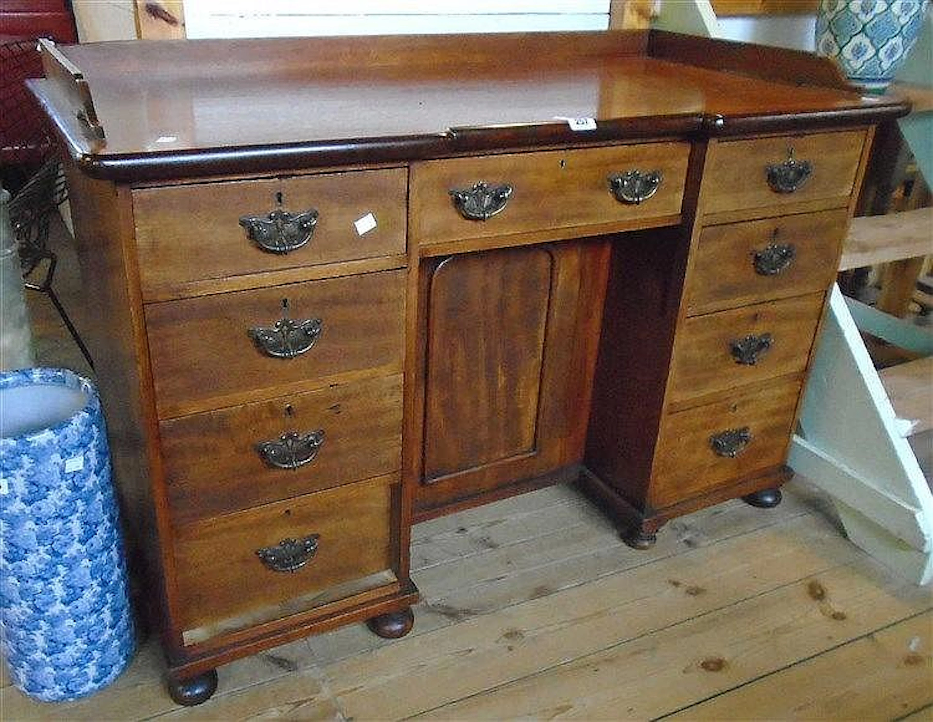 A 3' 9½" late Georgian mahogany knee-hole desk with later galleried top, th