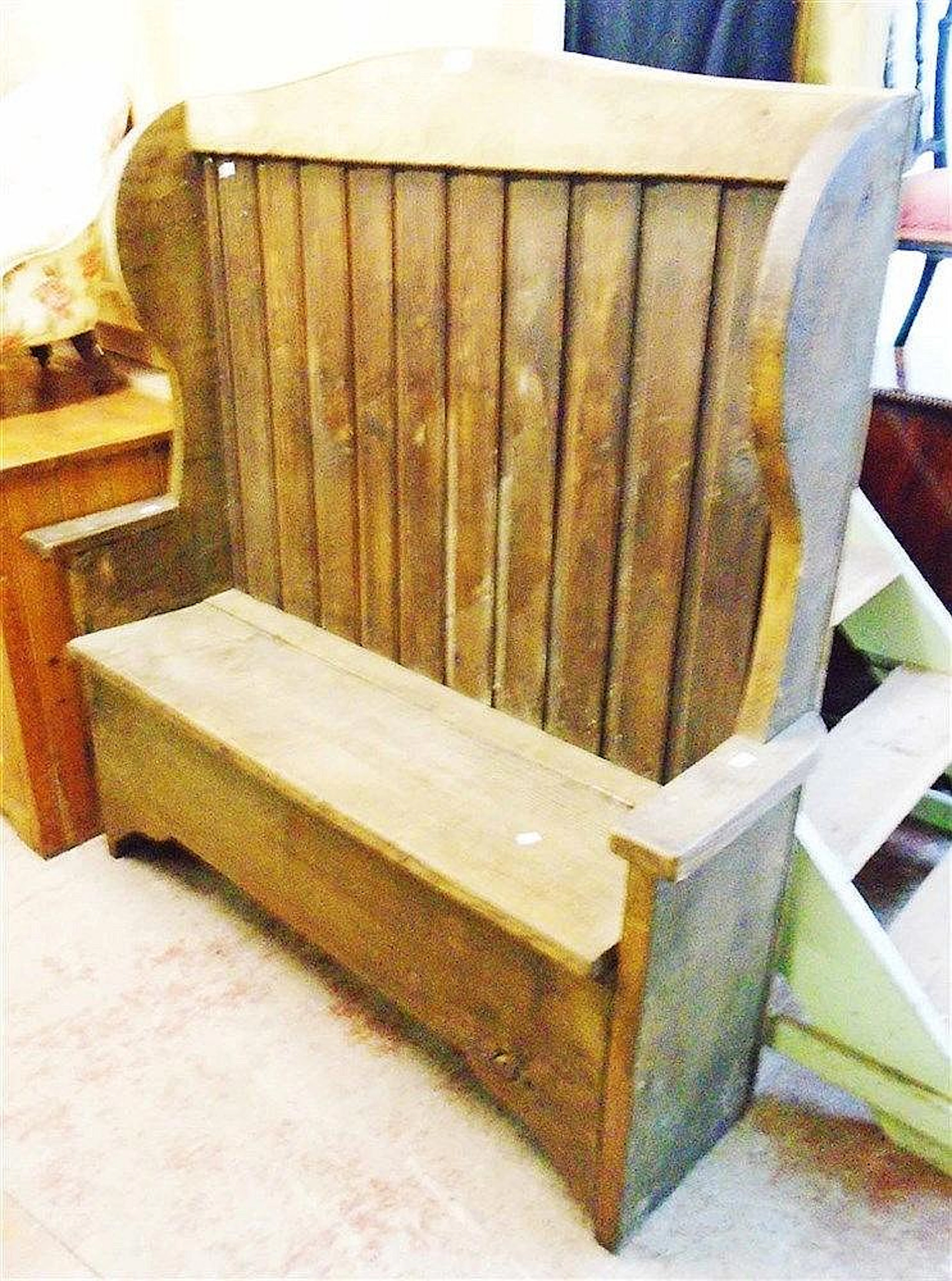 A 4' 5" chestnut tavern settle with shaped wing sides, pine panelled back a