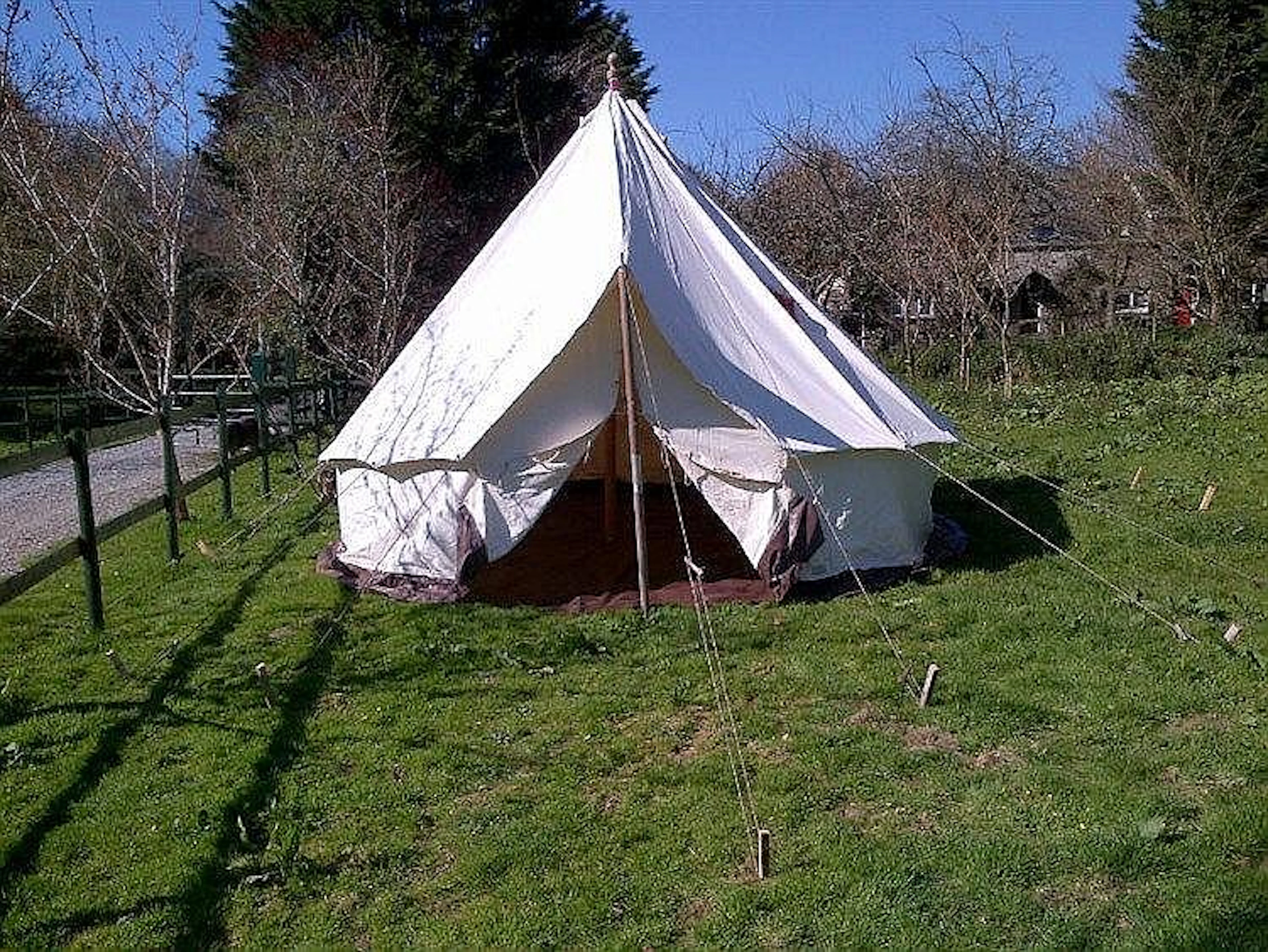 A 15' circular bell tent by Albion Canvas Co., with white canvas, plastic c