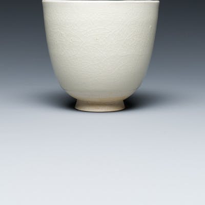 A Chinese white-glazed wine cup, probably Sui