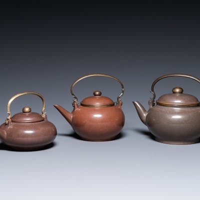 Three Chinese polished Yixing stoneware teapots and covers for the