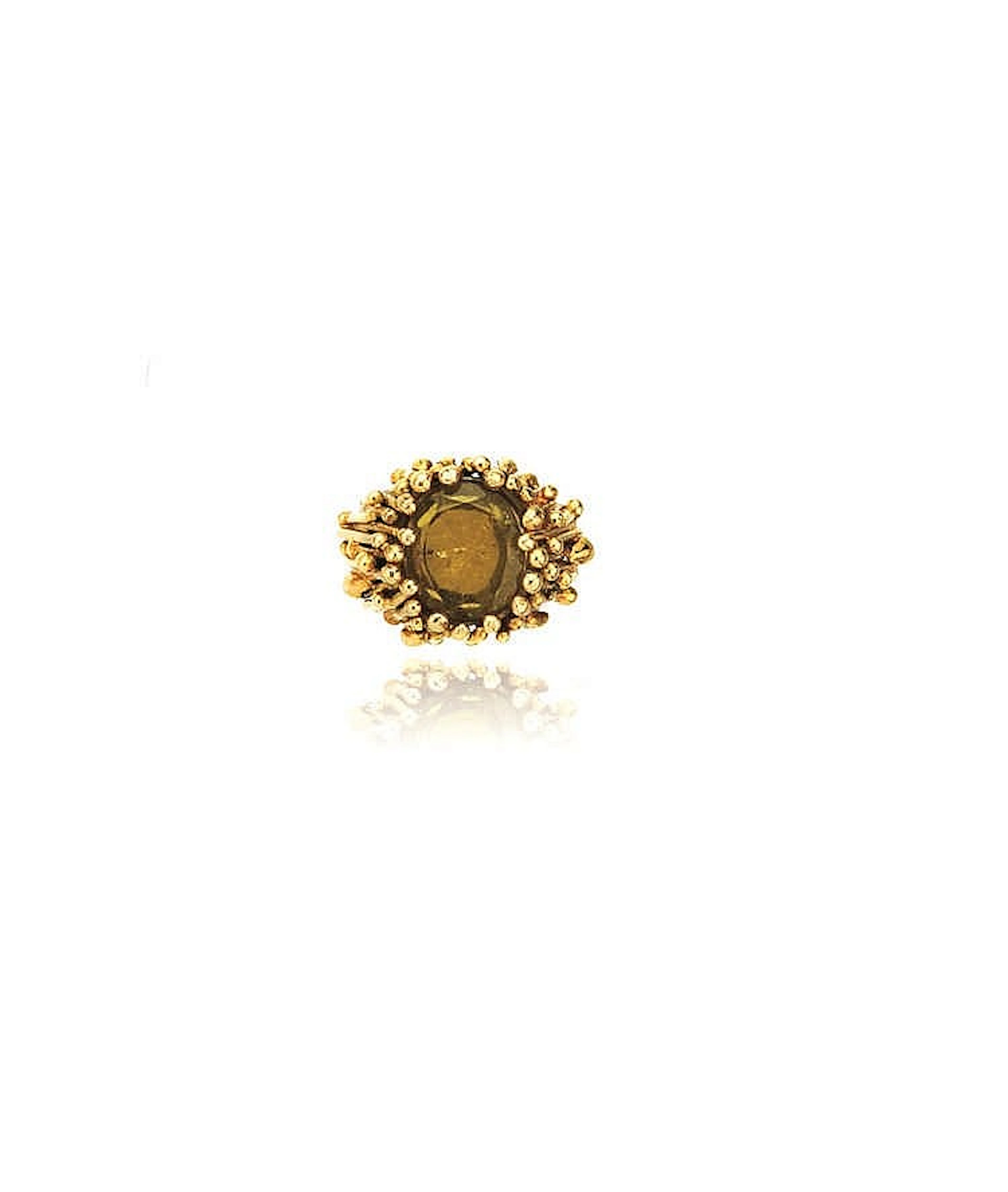 ANELLO IN ORO GIALLO E TORMALINAdisegnato come una corolla bombata deco