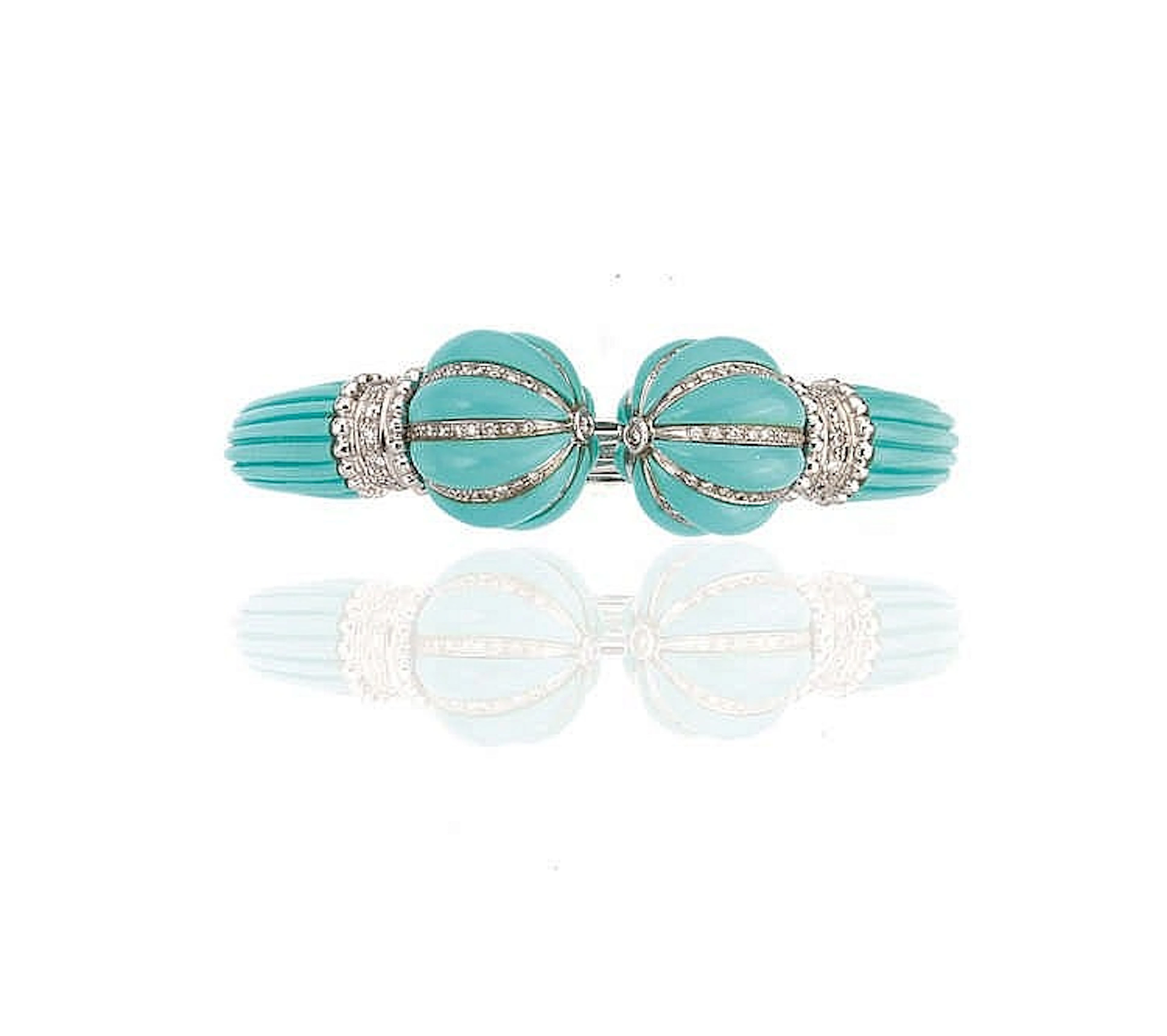 BRACCIALE IN ORO BIANCO, PASTA DI TURCHESE E DIAMANTIdiegnato come un c