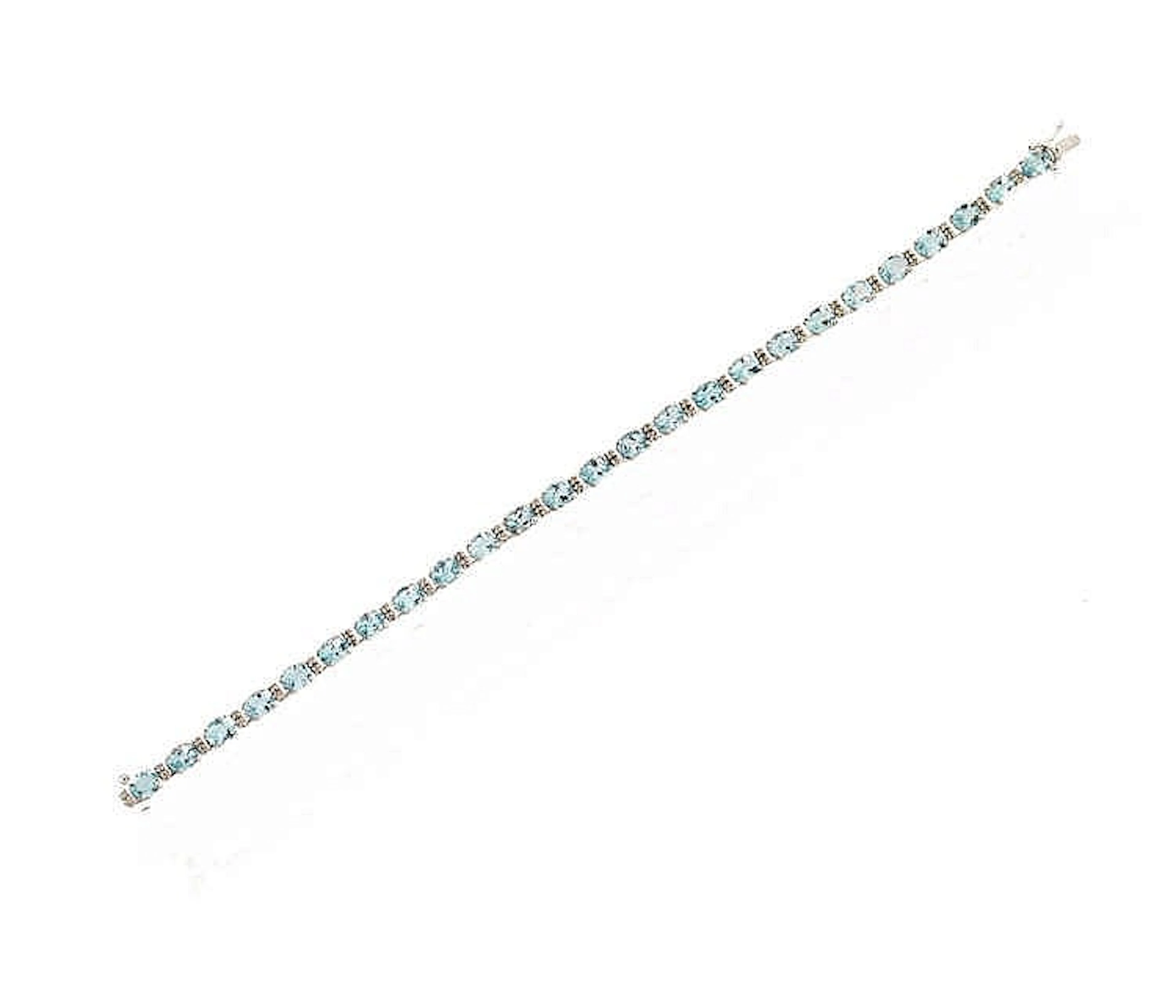 BRACCIALE TENNIS IN ORO BIANCO, ACQUAMARINA E DIAMANTIrealizzato ad una