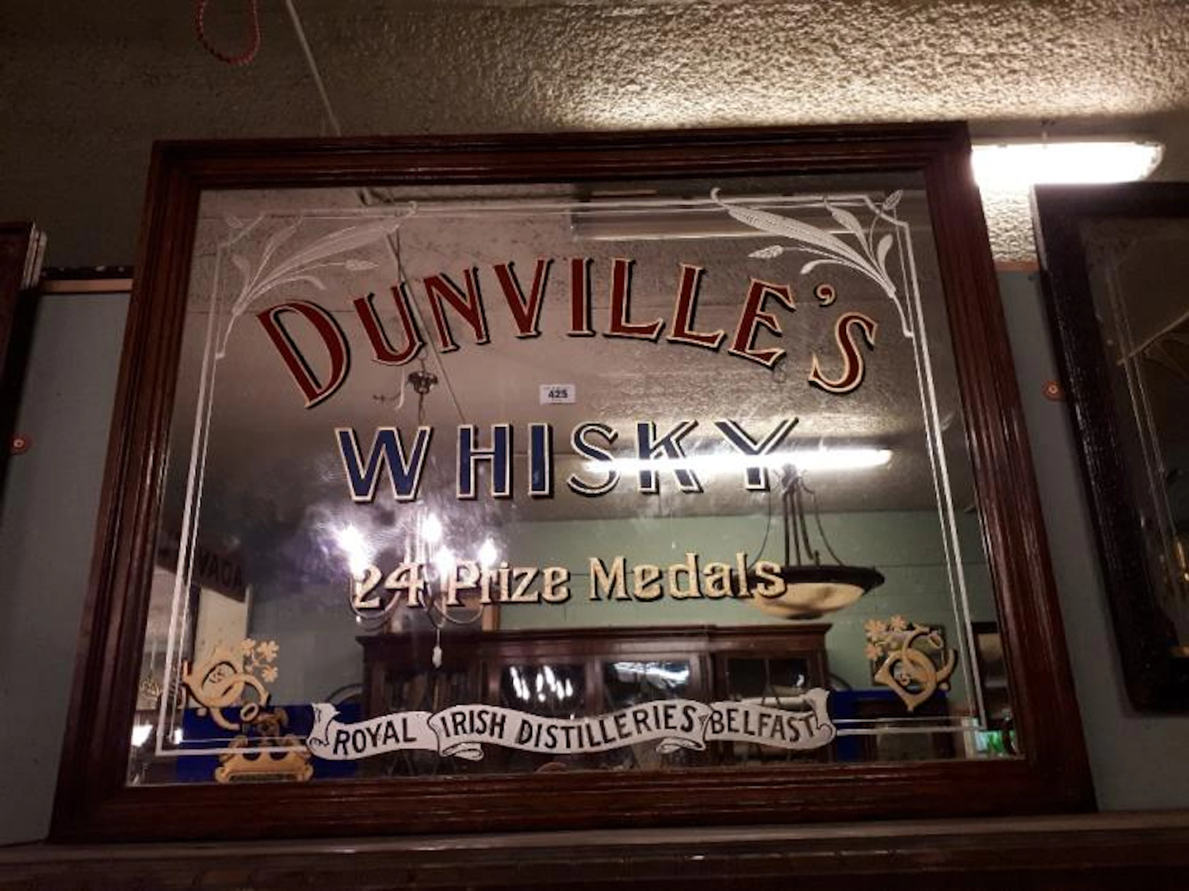 Rare large DUNVILLE'S WHISKY advertising mirror with 24 prize medals.