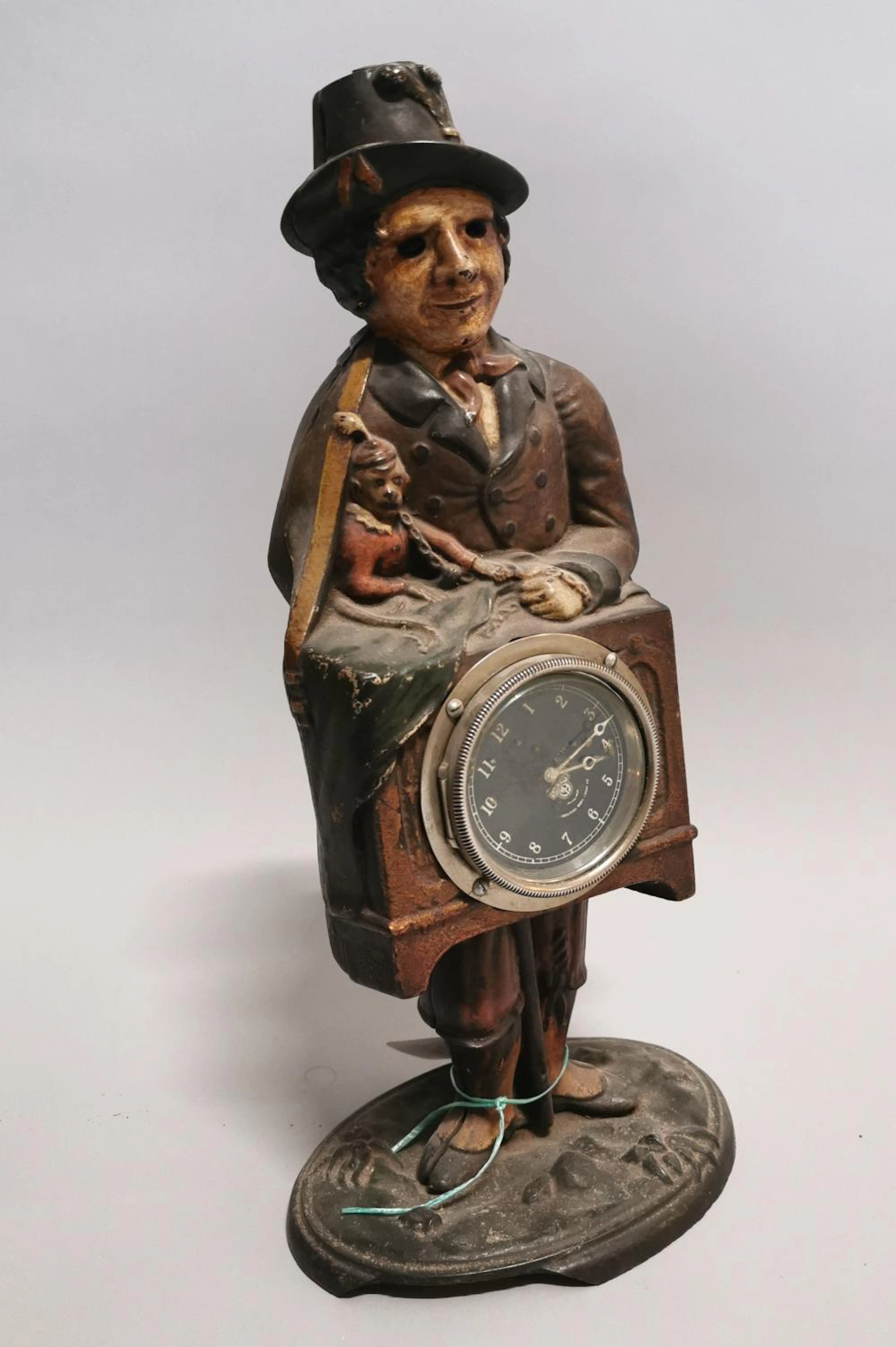18th C. hand painted cast iron mystery clock {47 cm H x 21 cm W x 15 cm D}.