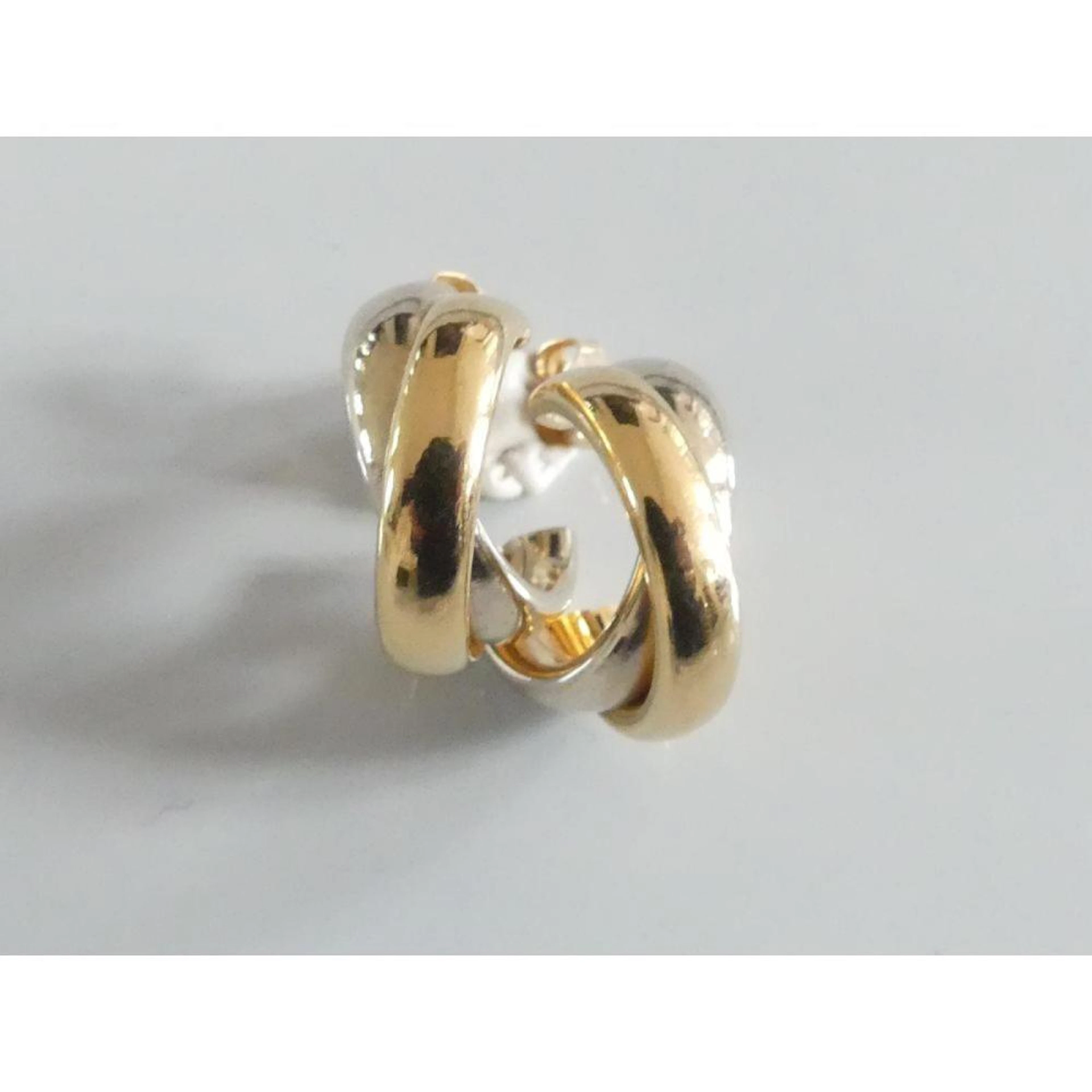 BOUCLE D?OREILLE 2 joncs 2 ors 750°/°° entrelacés. PB.2,57grs.