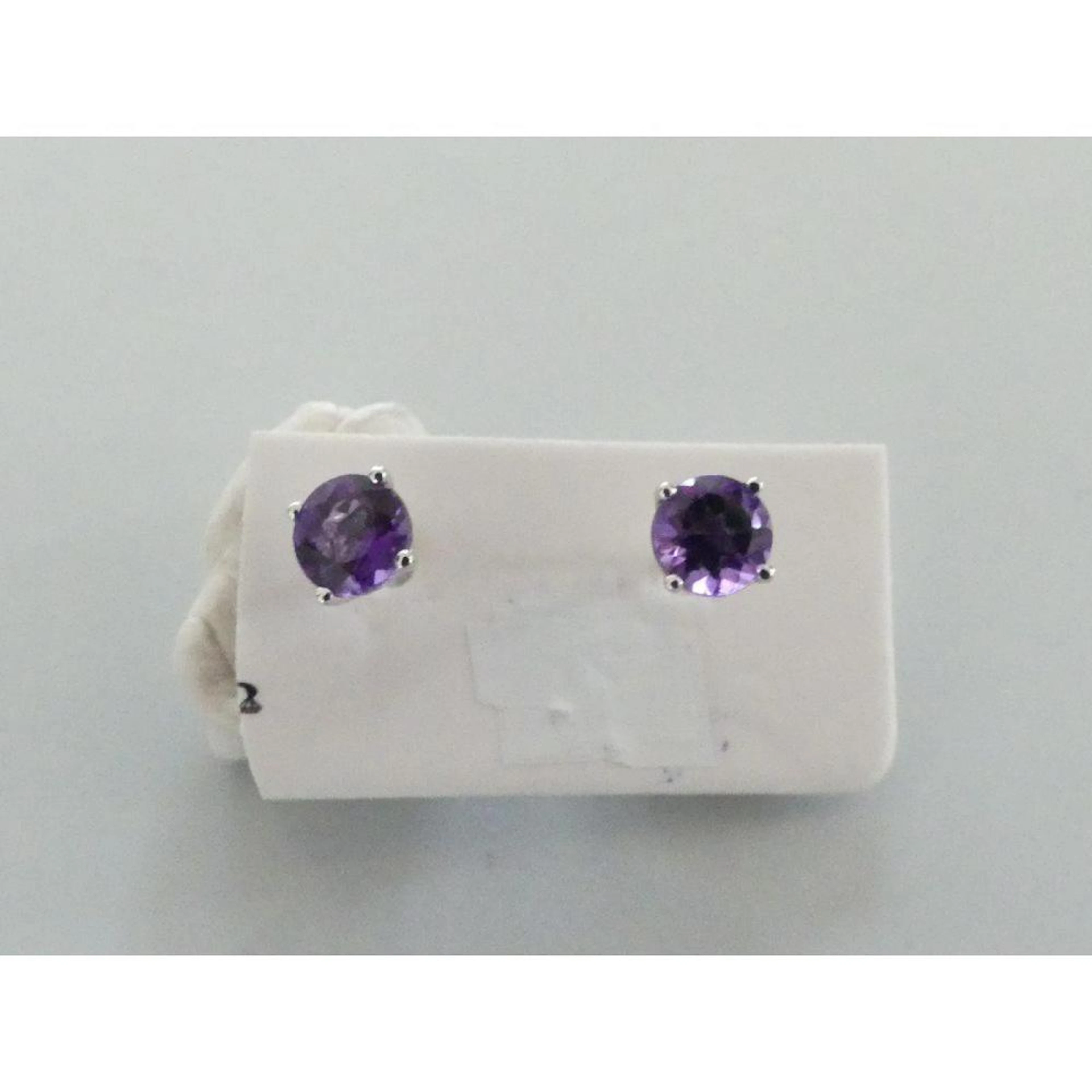 PAIRE DE BOUTONS D?OREILLES en or blanc 750°/°° ornés de...
