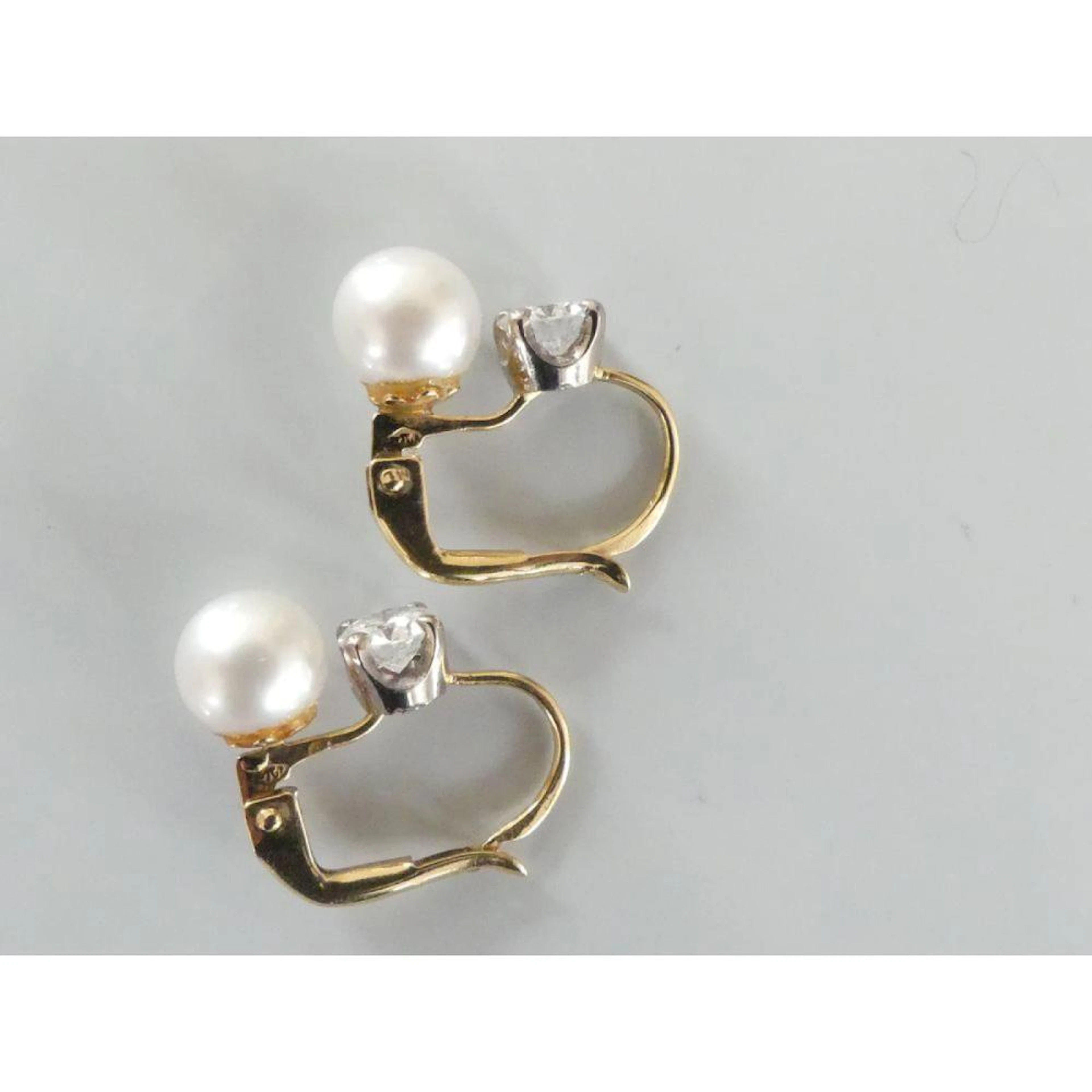 PAIRE DE BOUCLES D?OREILLES dormeuses en or jaune 750°/°°...