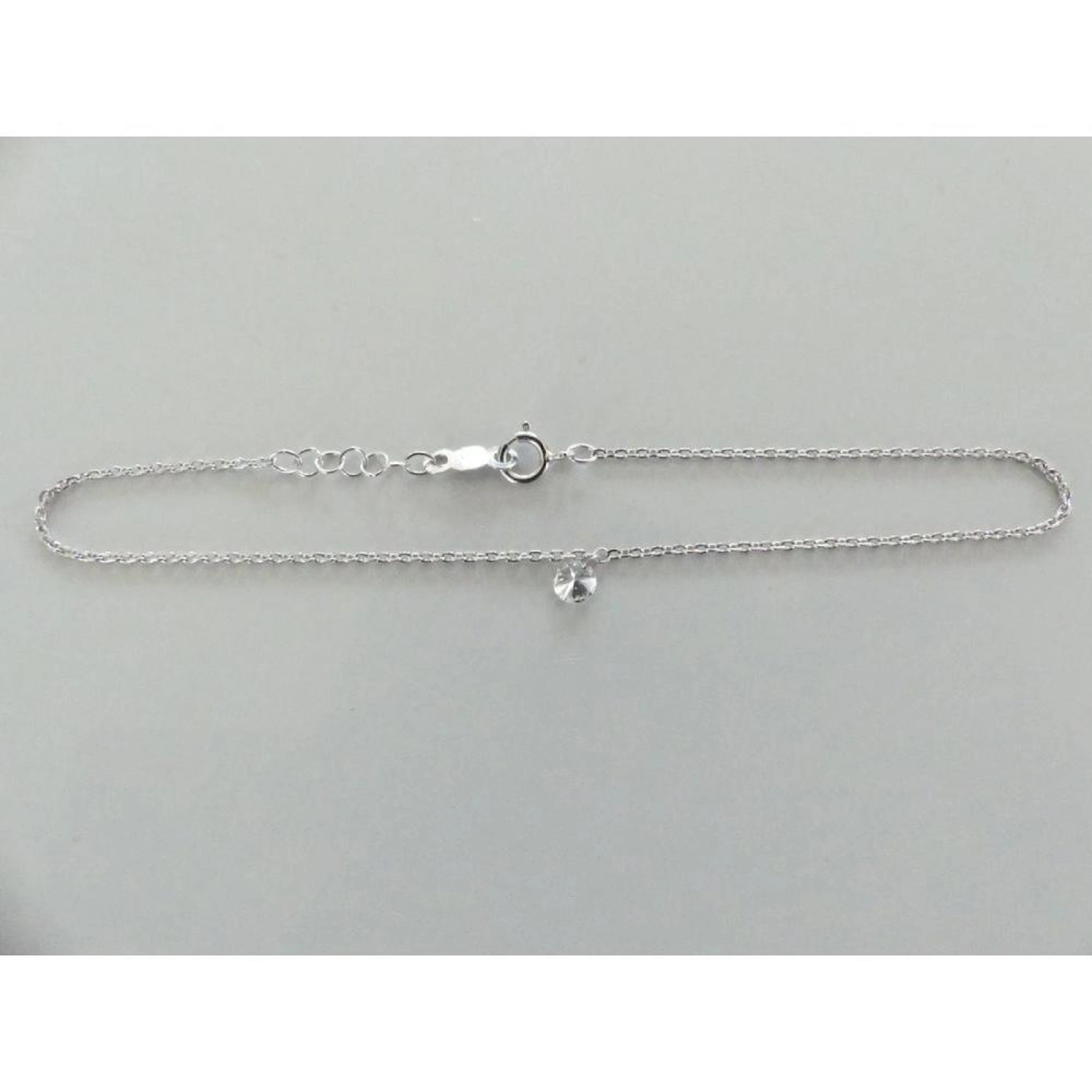 BRACELET en or 750°/°° maillon forçat orné d?un diamant en pendant. PB.0,80grs.