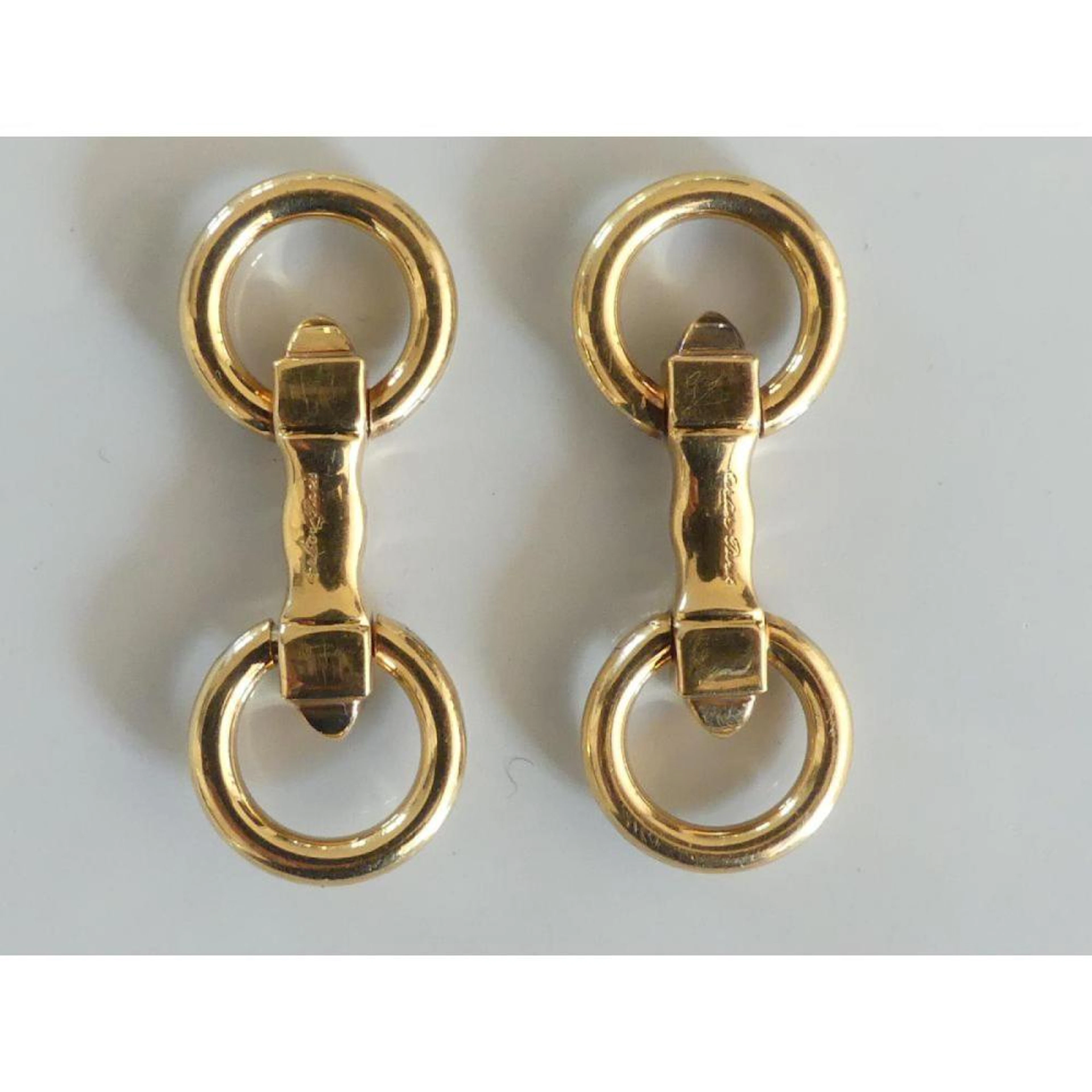 CARTIER. Boutons de manchette en or 750°/°° représentant 2 cercles