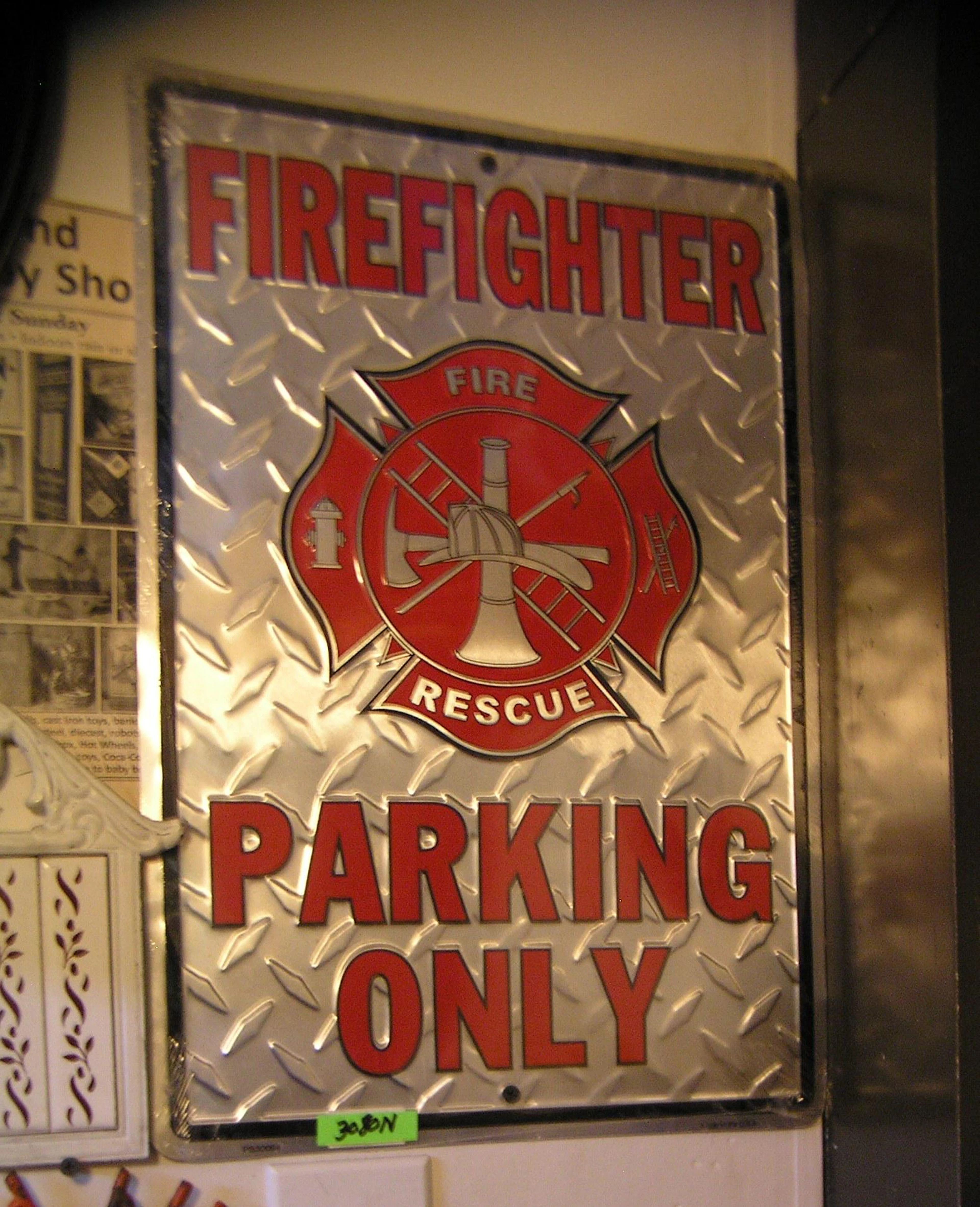 All metal fire fighter parking only display sig