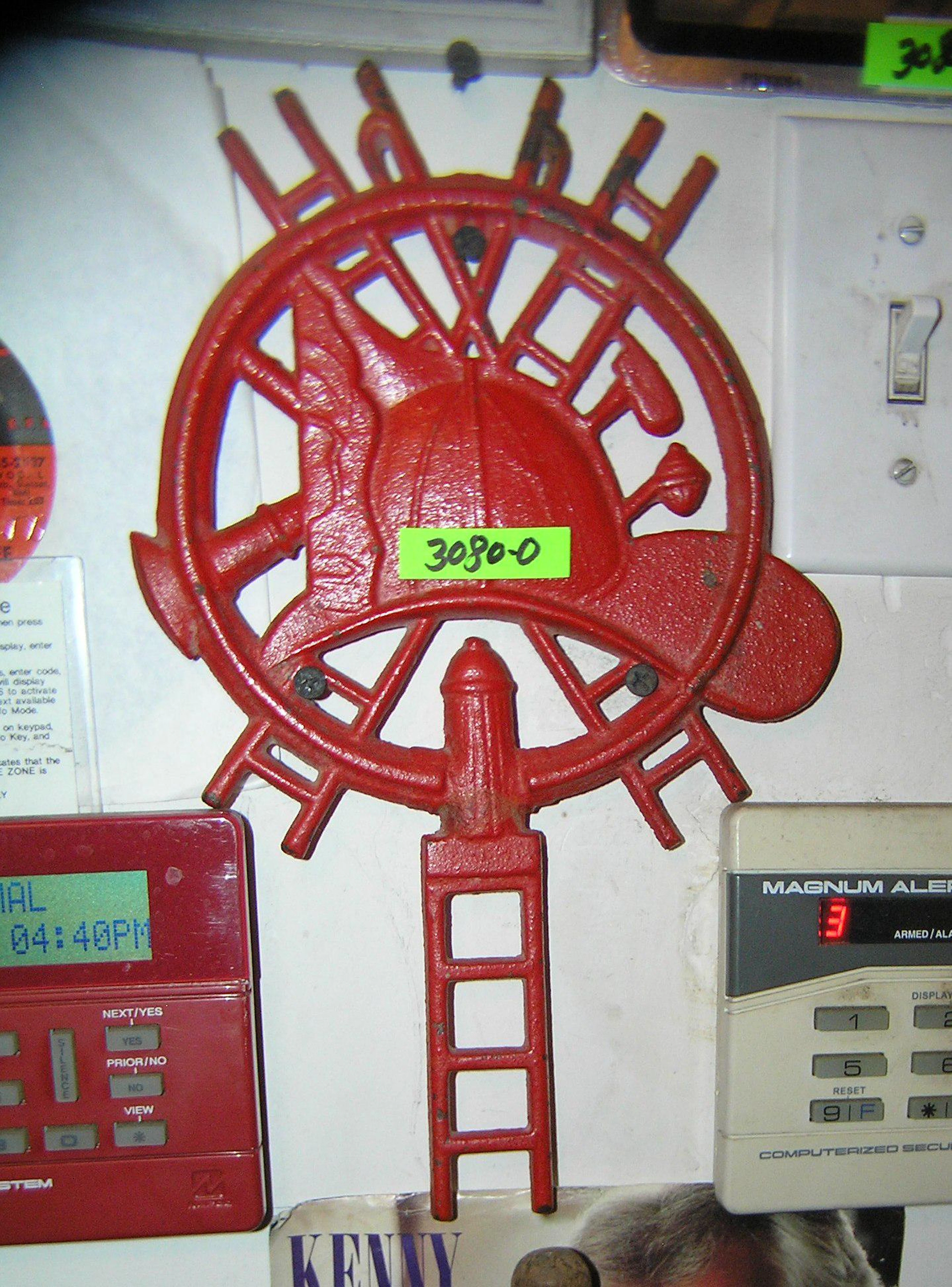 Cast iron fire dept themed trivet