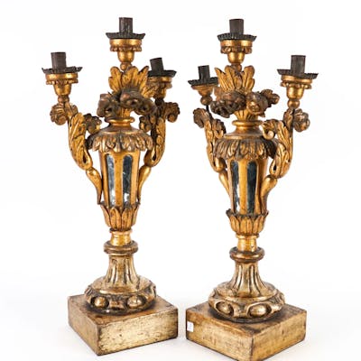 A PAIR OF ITALIAN SILVERED AND GILT WOOD THREE LIGHT CANDELABRA (2)