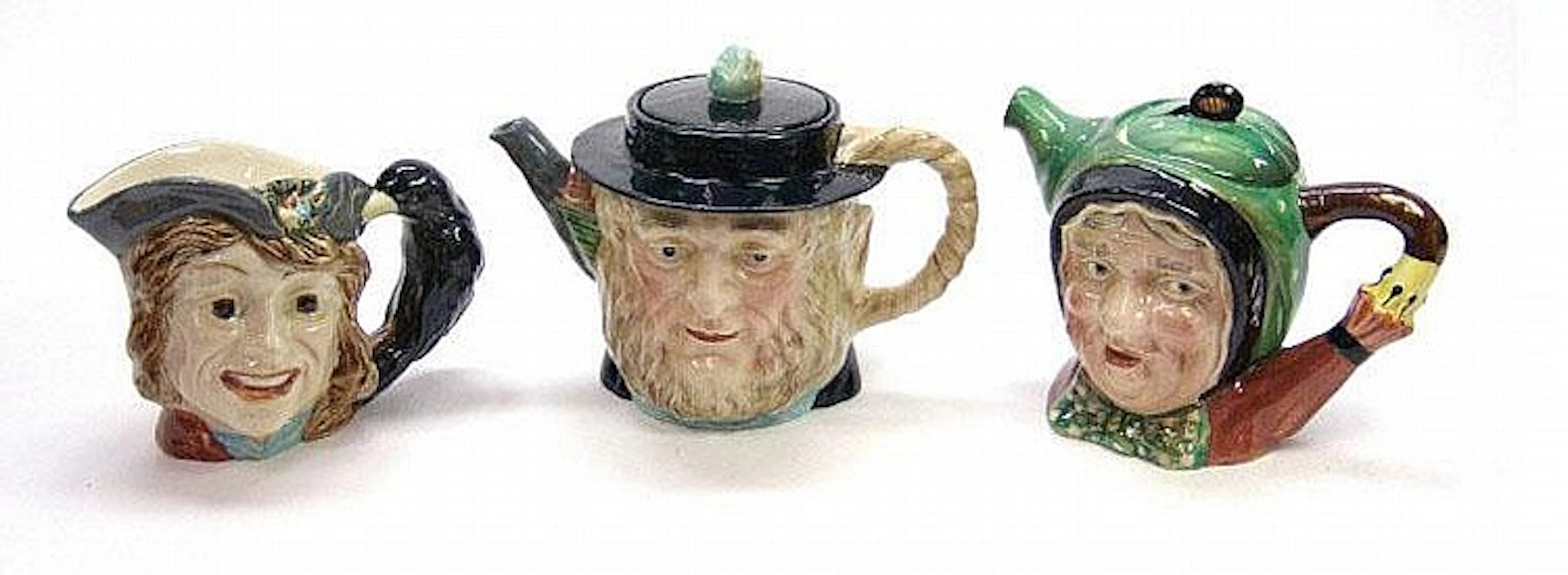 Two Beswick character teapots and a character jug