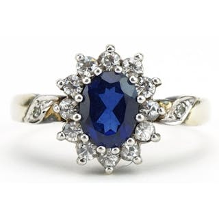 Silver blue sapphire and clear stone ring with diamond set s...