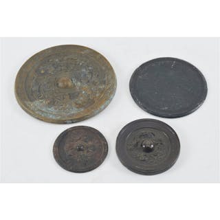 4 bronze mirrors. China. Ming period and earlier. Largest 6.5in.