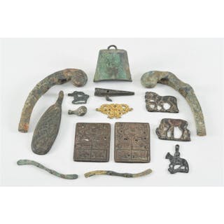12 ancient bronze fittings. China. Largest 5.25in.
