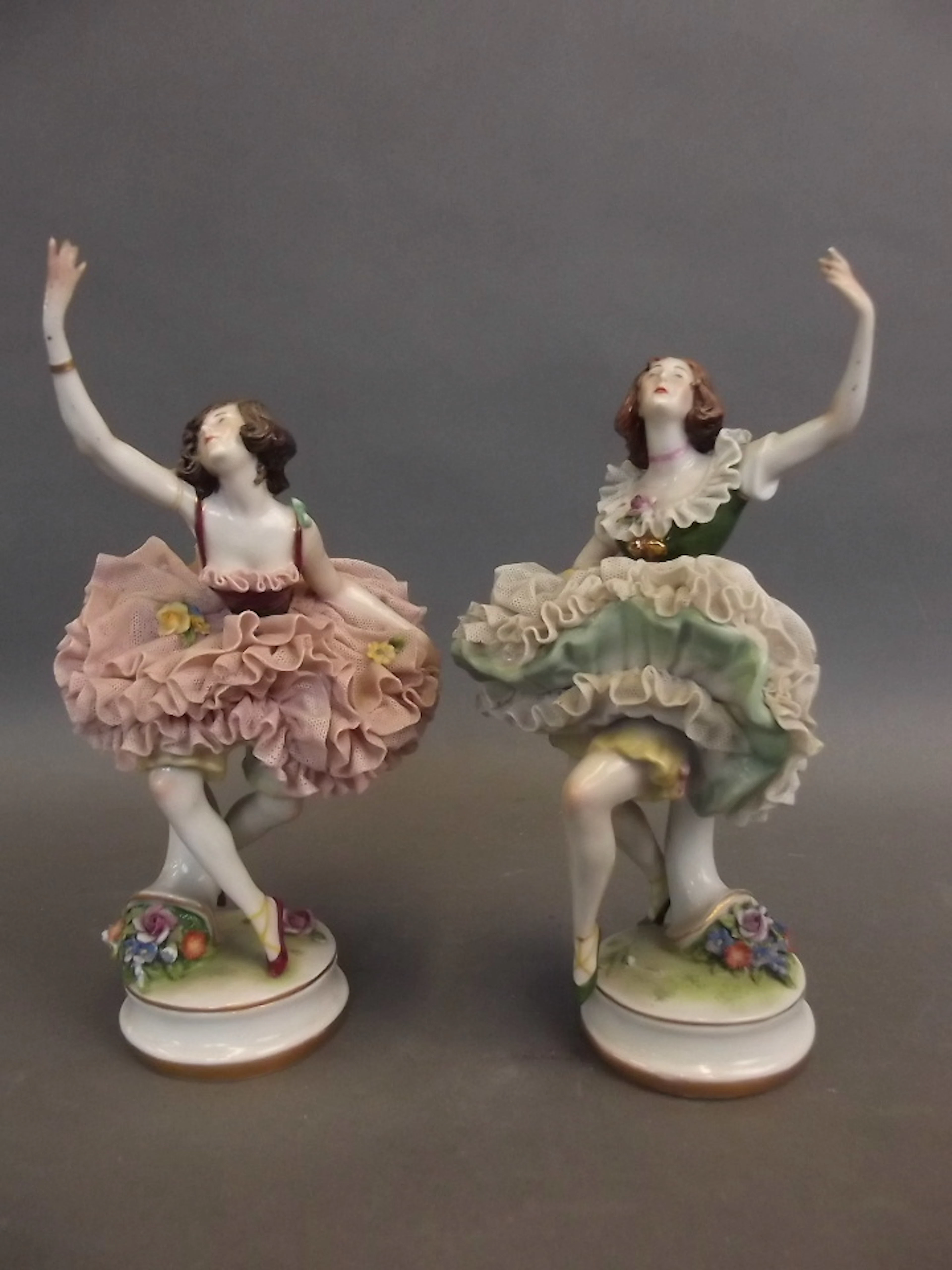 A pair of German porcelain figures of ballerinas in...