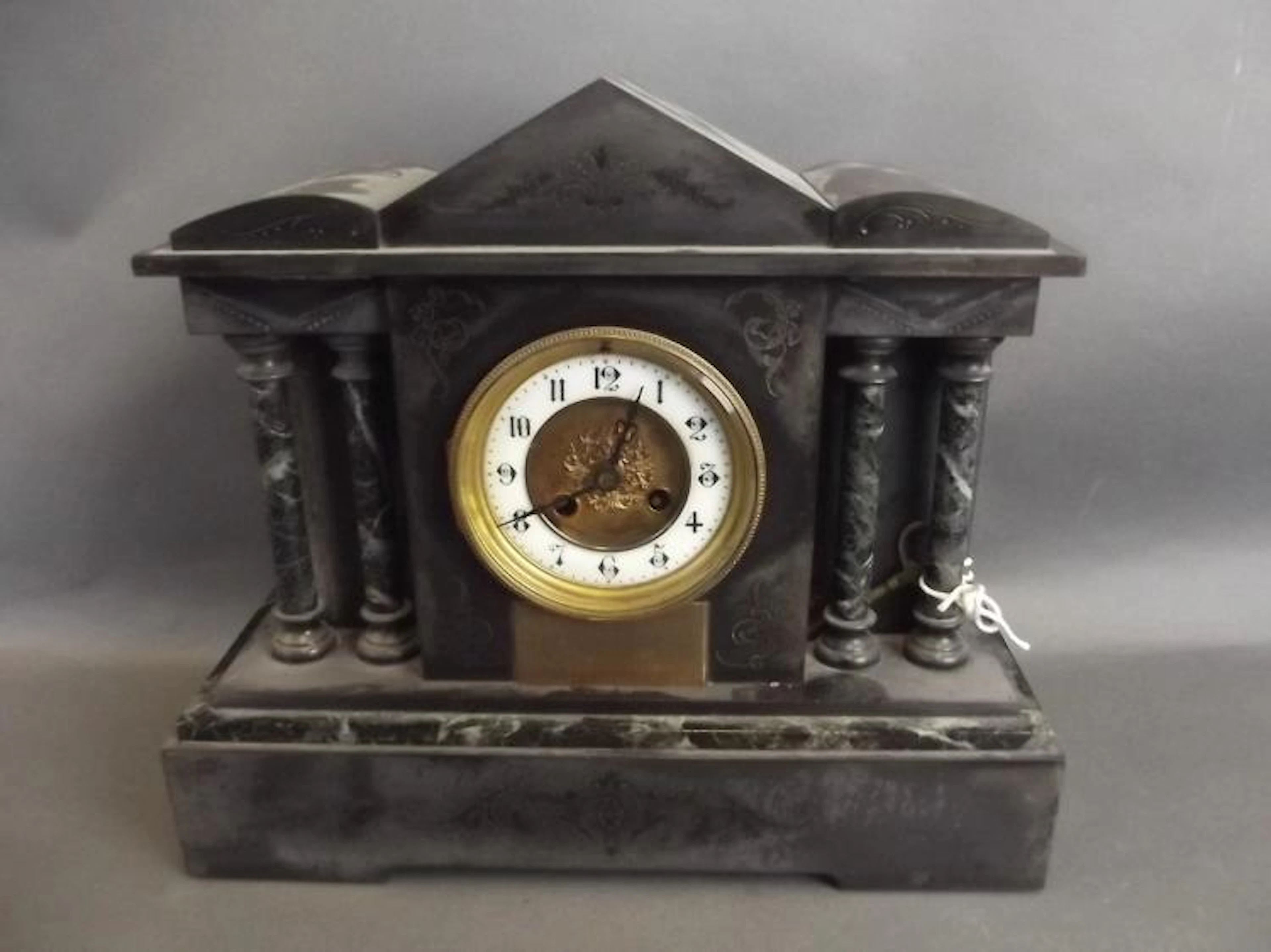 A Victorian slate and marble cased Parthenon style mantle...