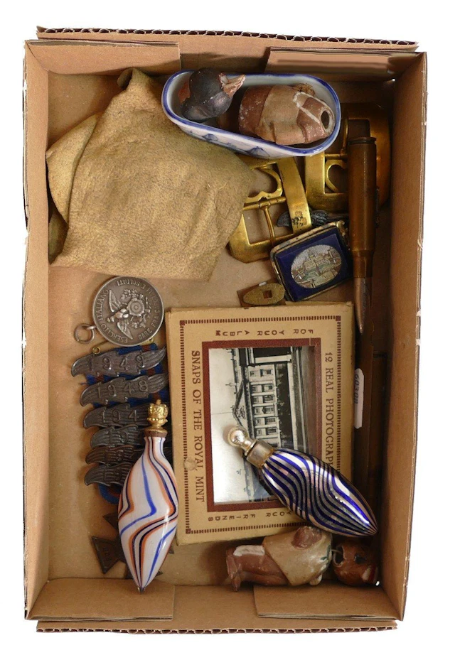 A collection of items including glass scent bottles