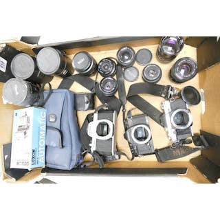 A collection of vintage camera equipment to include Olympus OM-30