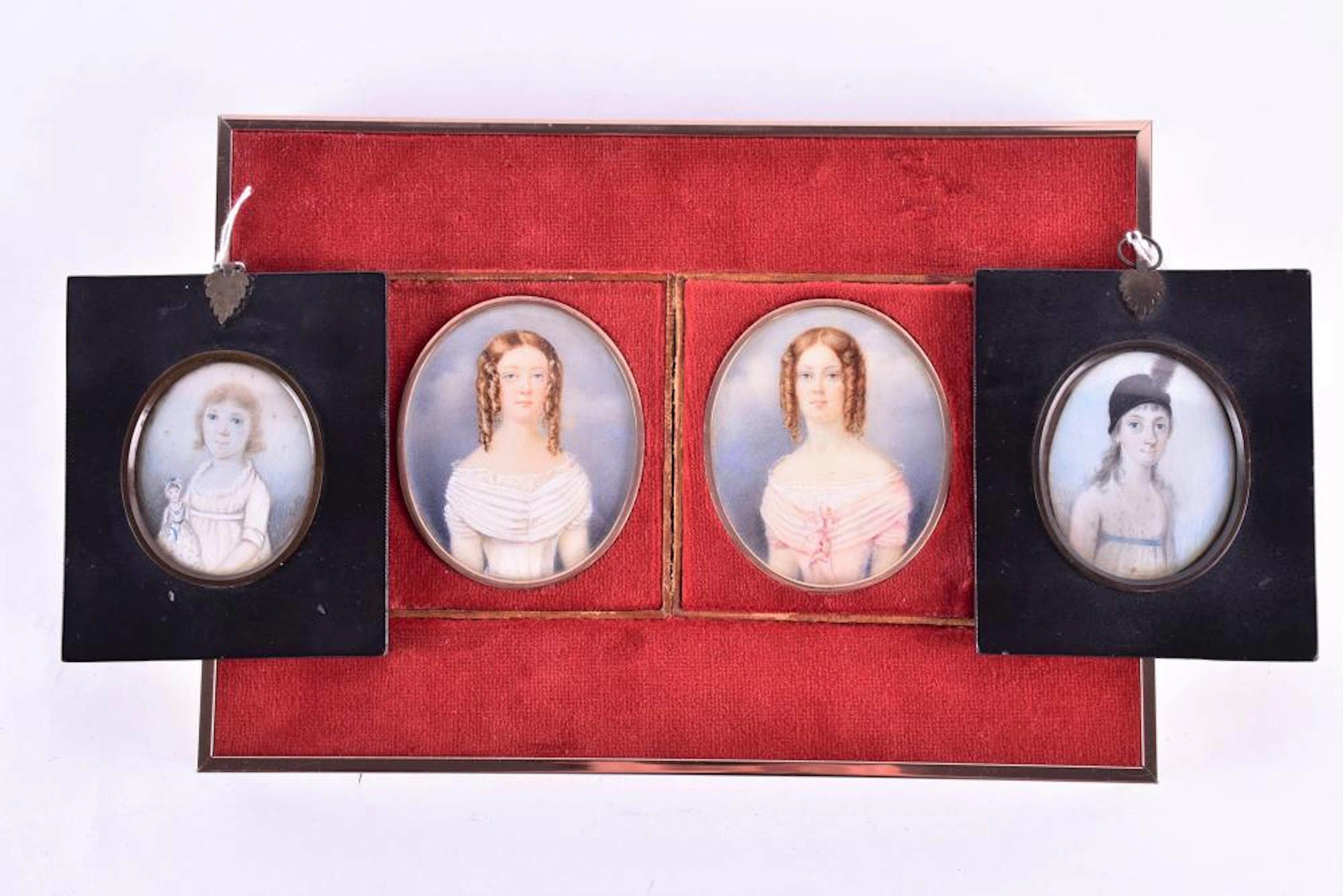A pair of late 18th century oval portrait miniatures on ivory