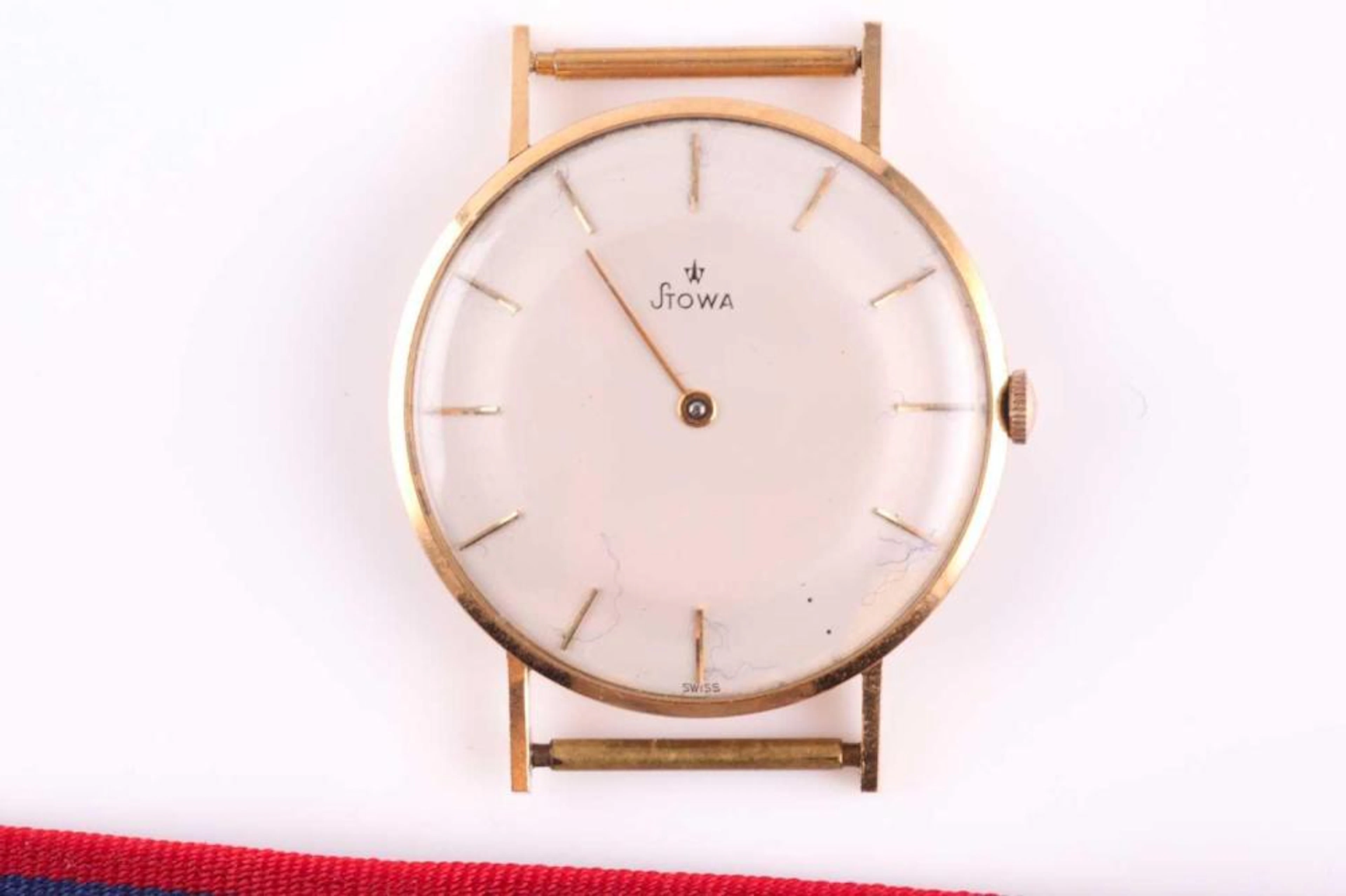 A yellow metal Stowa watch