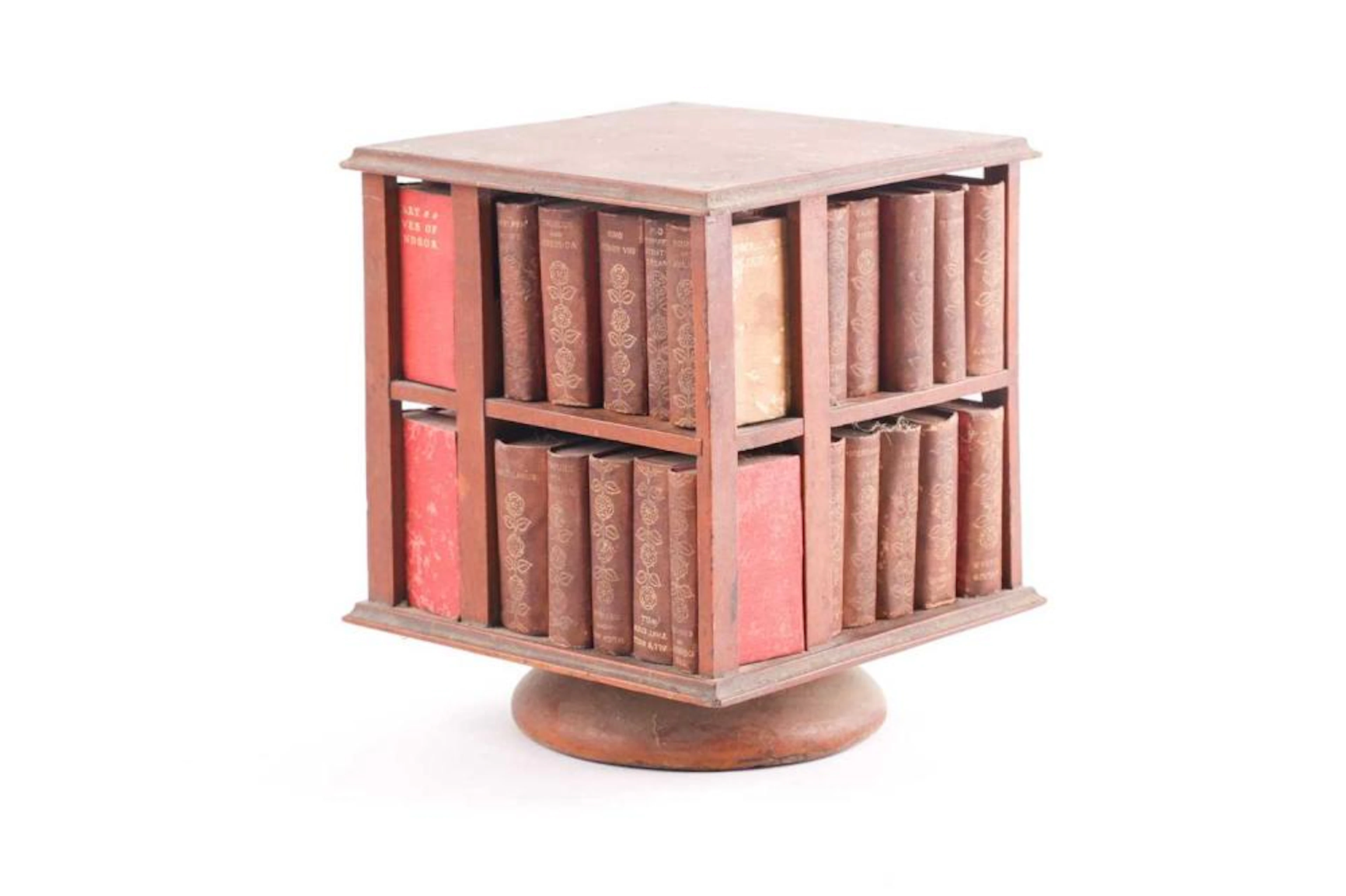 A 19th-century revolving miniature bookcase