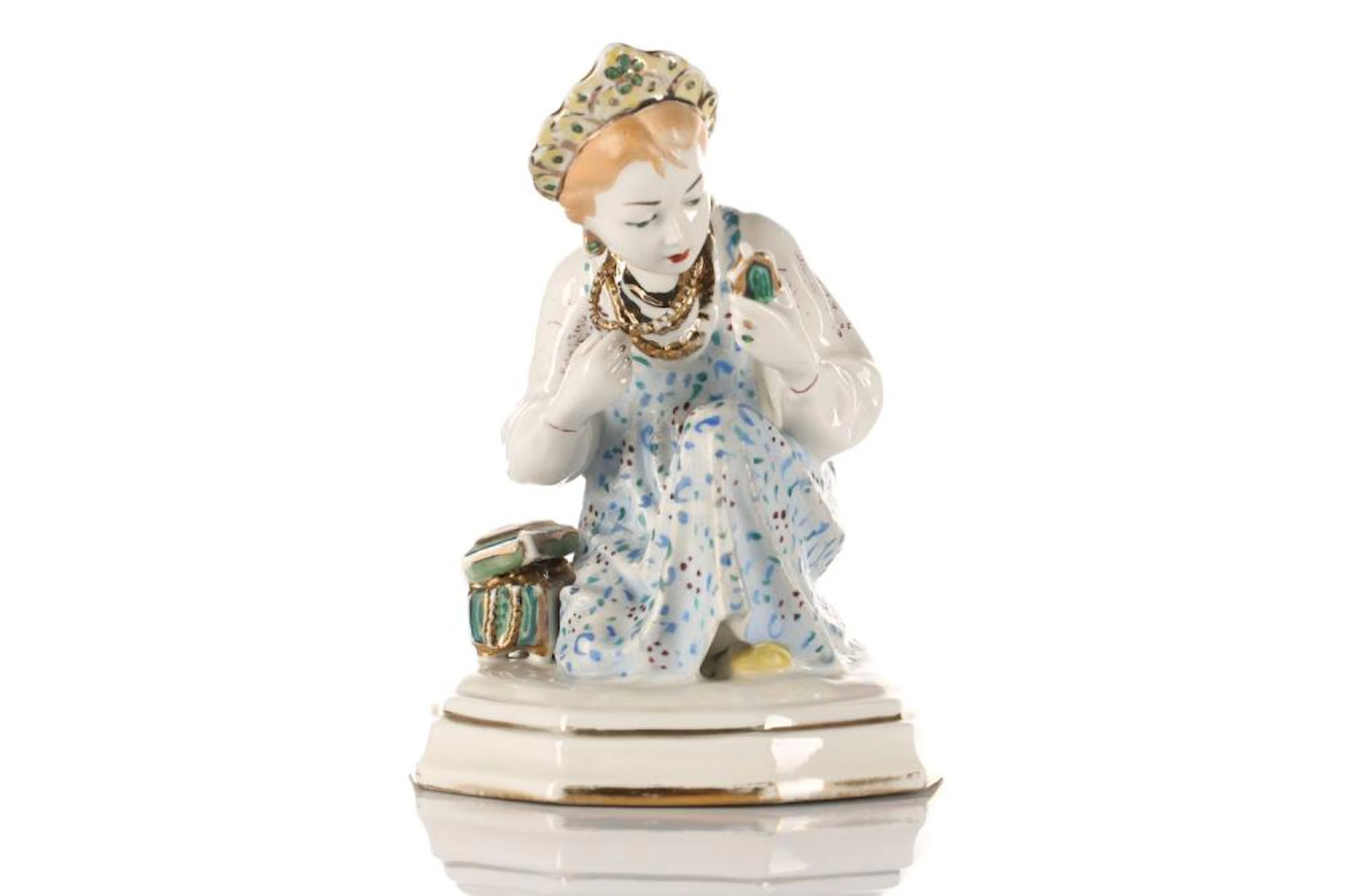 A 20th century Russian porcelain figure of a girl in traditional dress