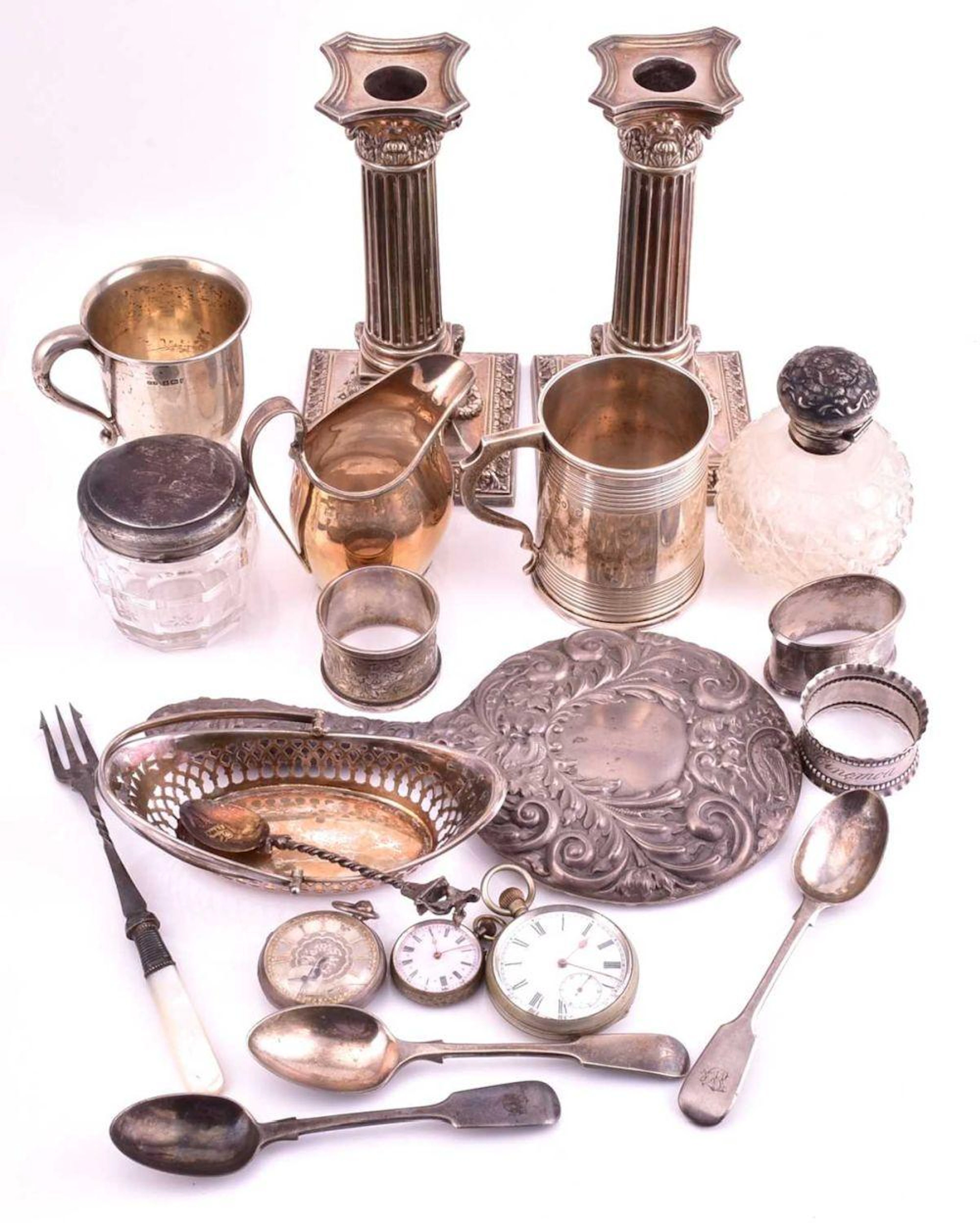 A collection of silver and silver plate to include a pair...