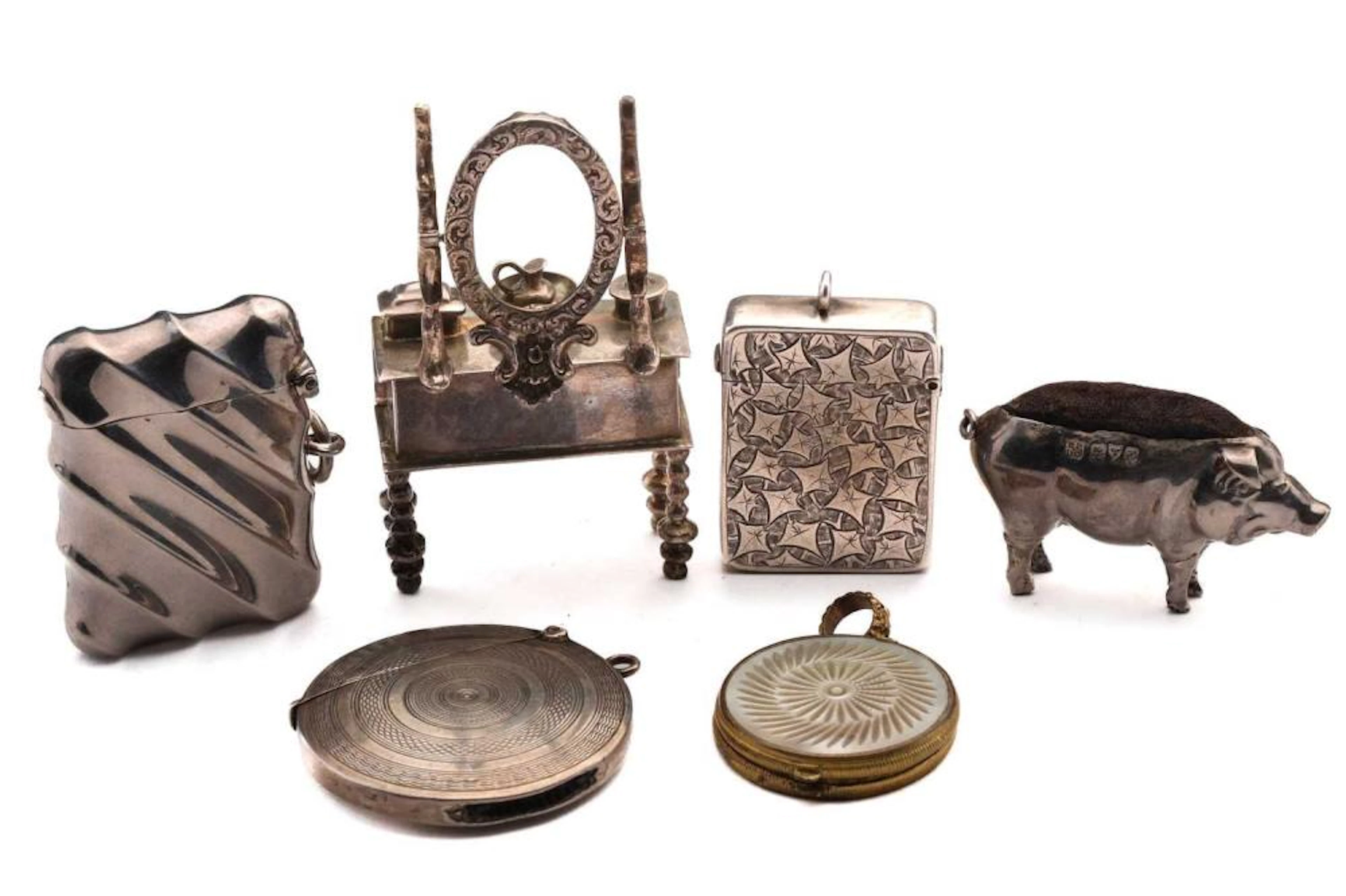 An Edwardian pin cushion in the form of a pig; Chester...