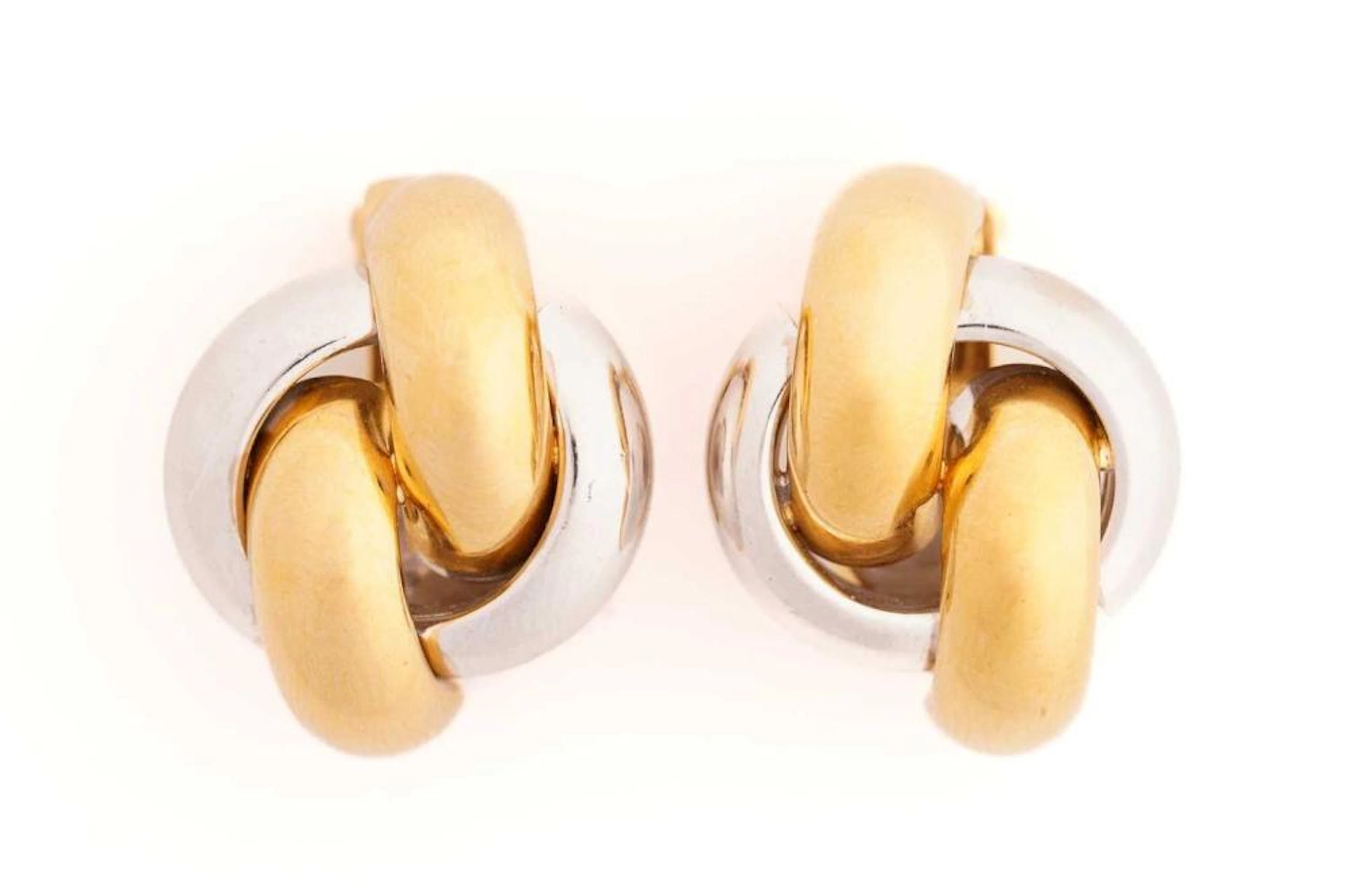 A pair of two-tone clip-on earrings