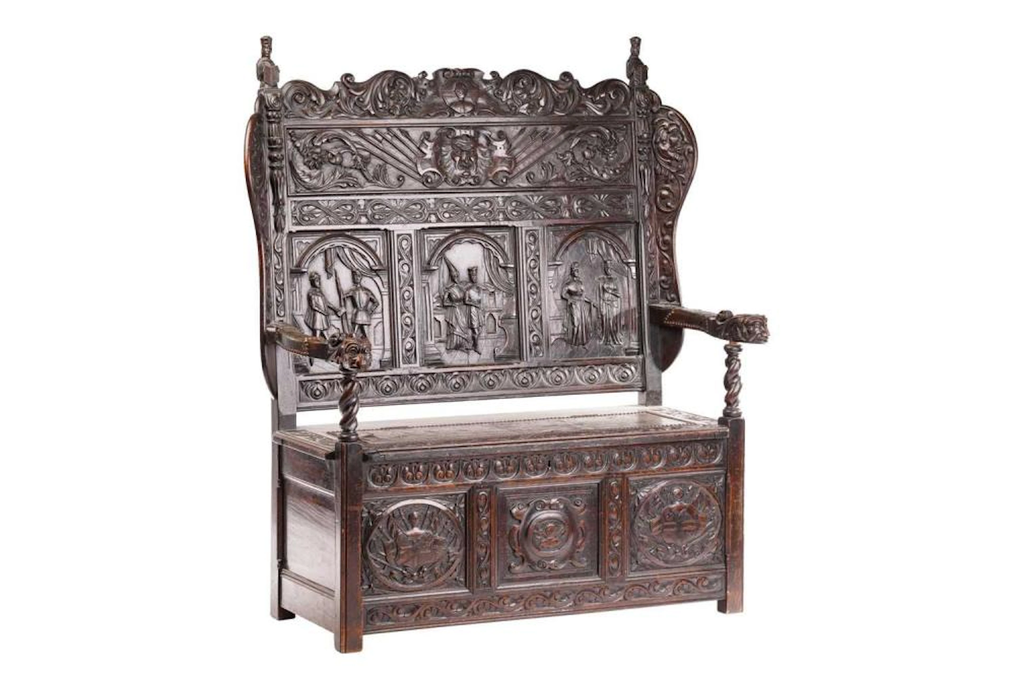 A 19th-century "Jacobethan" box settle with high back and...