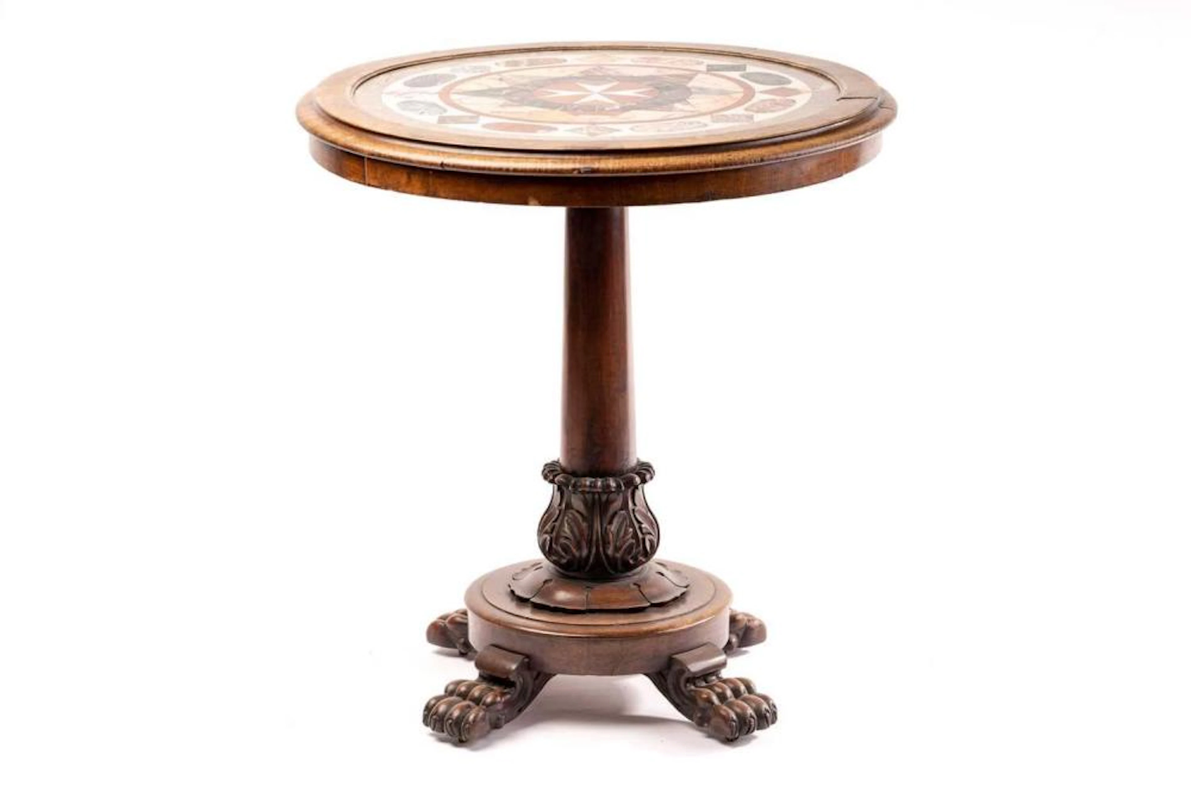 A Victorian circular walnut centre table with an inlaid...