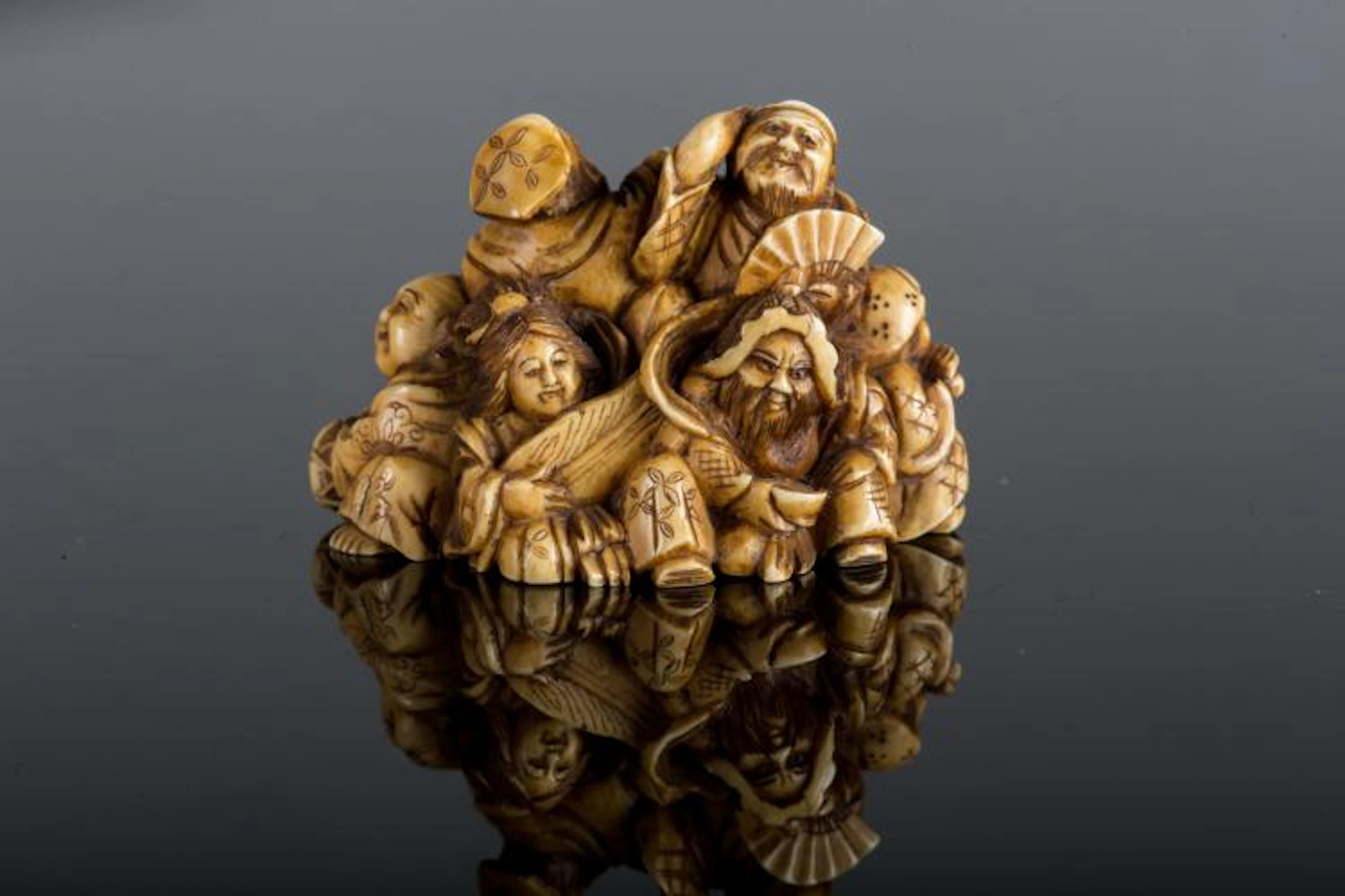 Arte Giapponese An ivory netsuke depicting the Fortune gods Japan, 19th century