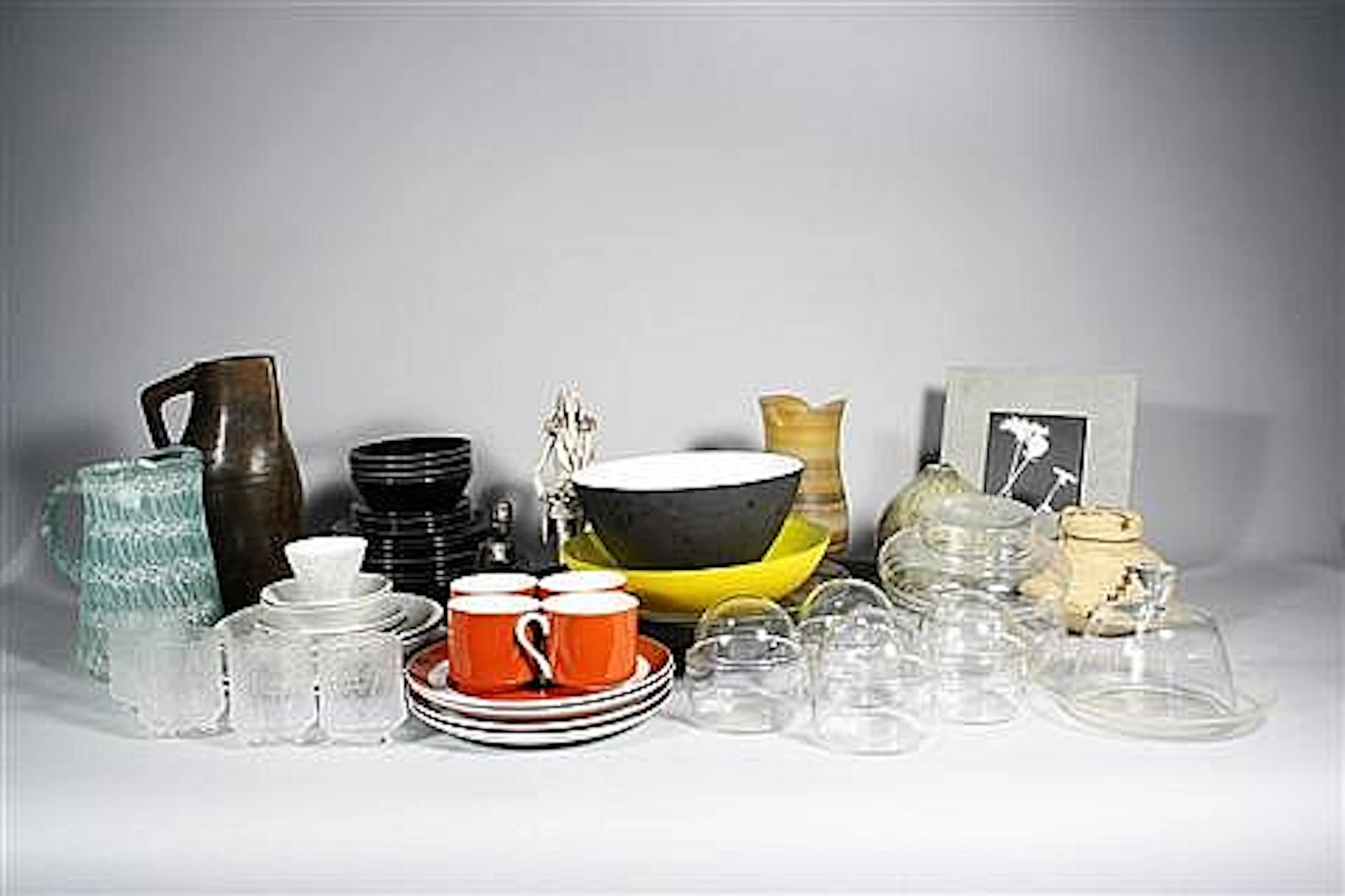 A collection of mid-century modern glass and ceramic decorative items,