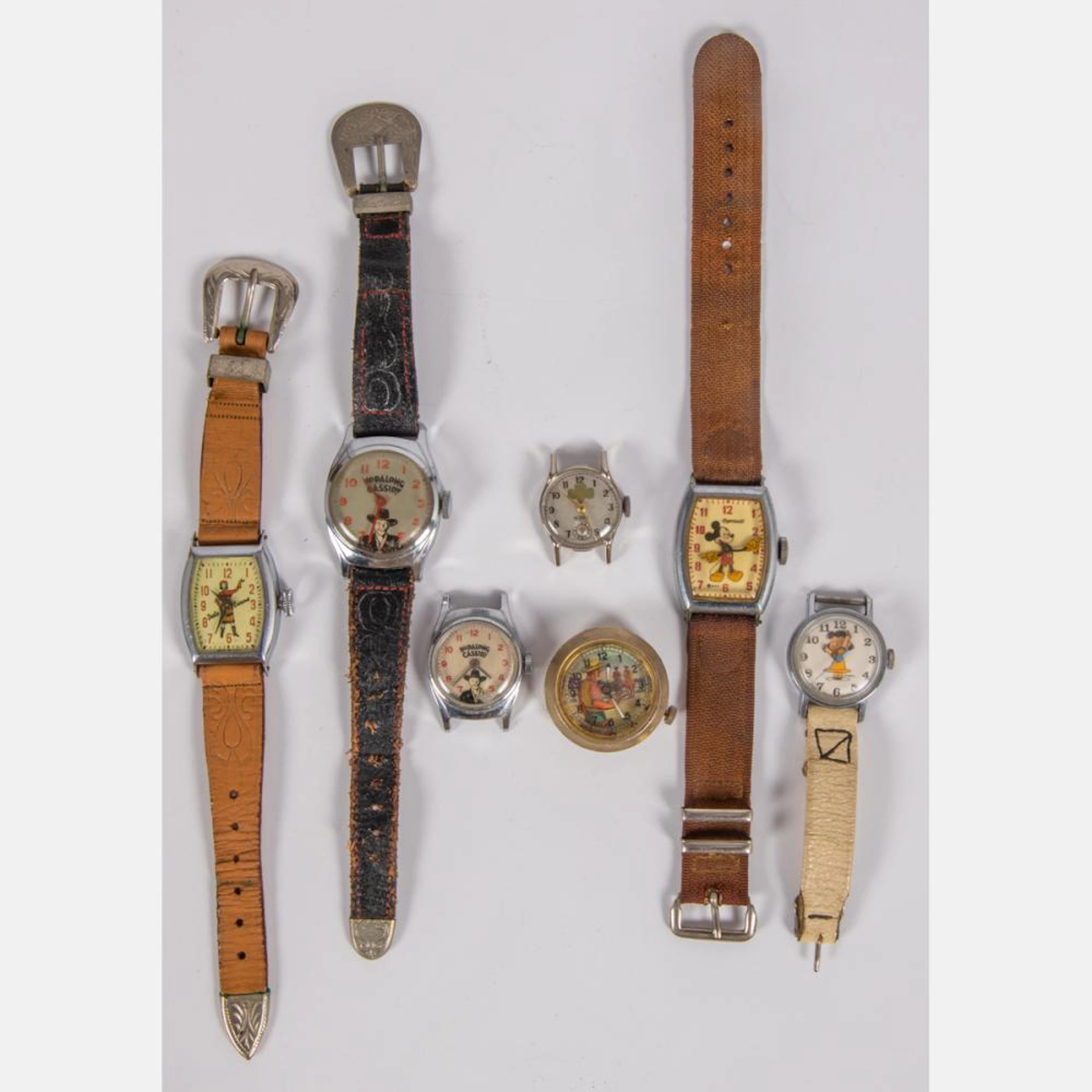 A COLLECTION OF SEVEN ENTERTAINMENT THEMED WATCHES, 20TH CENTURY,
