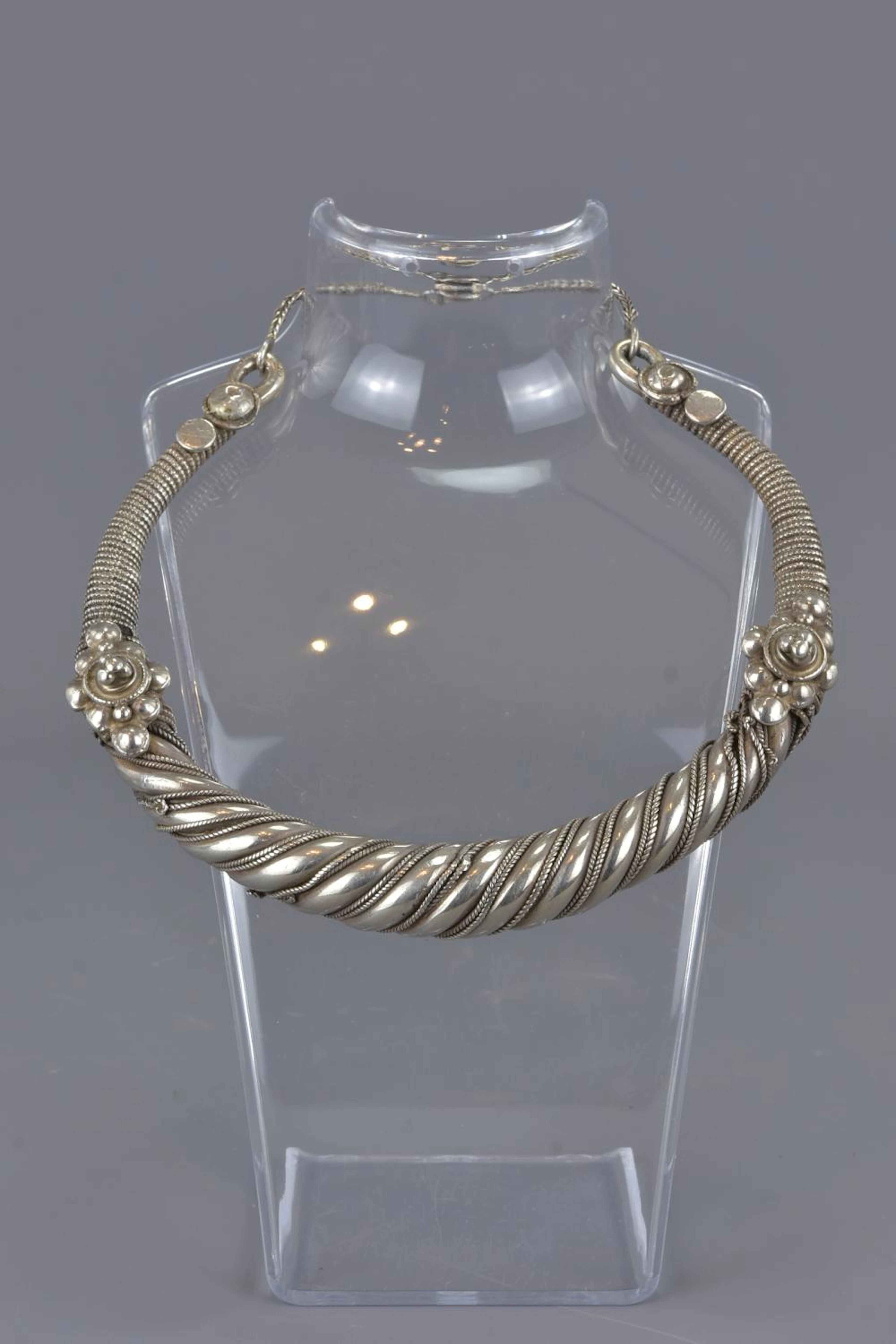An Indian 19/20th century silver and silver metal Torc neckl