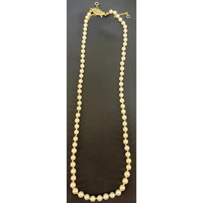 A single strand of cultured pearls Of even size. 9ct yellow ...