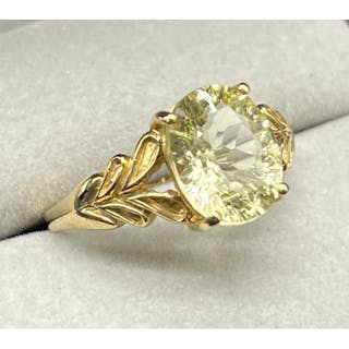 9ct yellow gold ring set with an oval cut Citrine stone. [Ri...