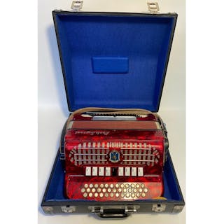 A Paolo Soprani button accordian in fitted case [40x40cm]