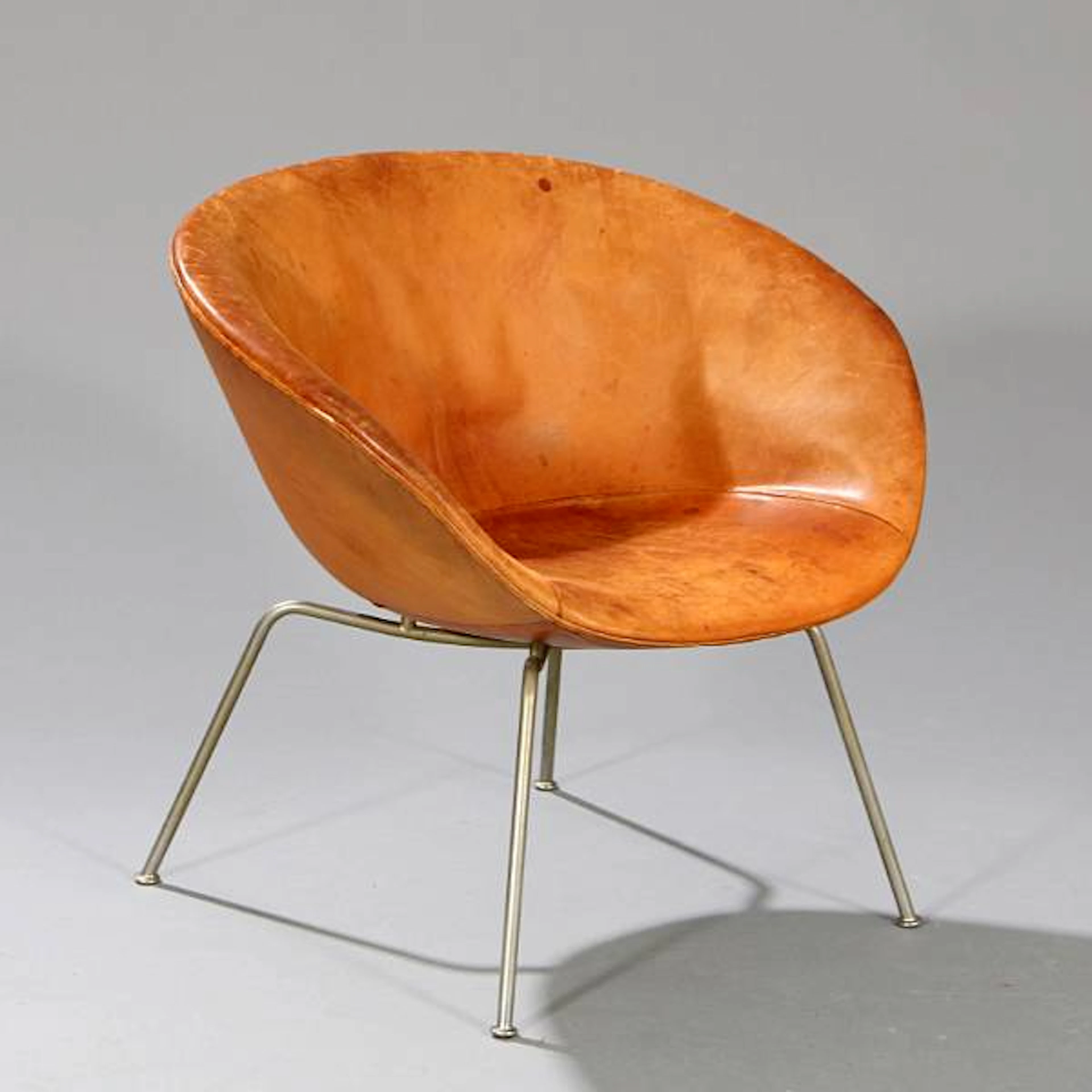 Arne Jacobsen: "The Pot Chair". Easy chair with chromed steel legs