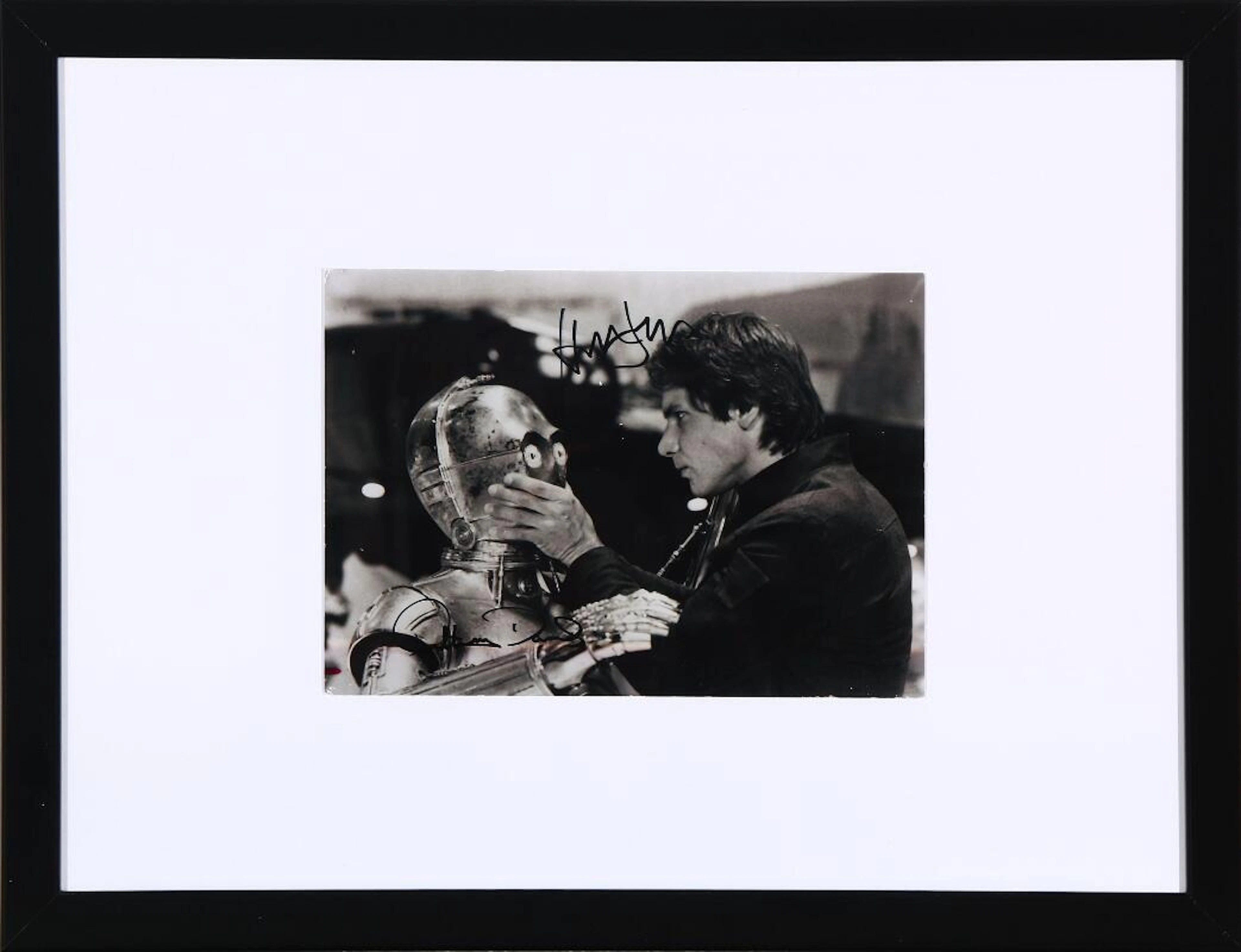 A doubble signed black-and-white photograph of the actors