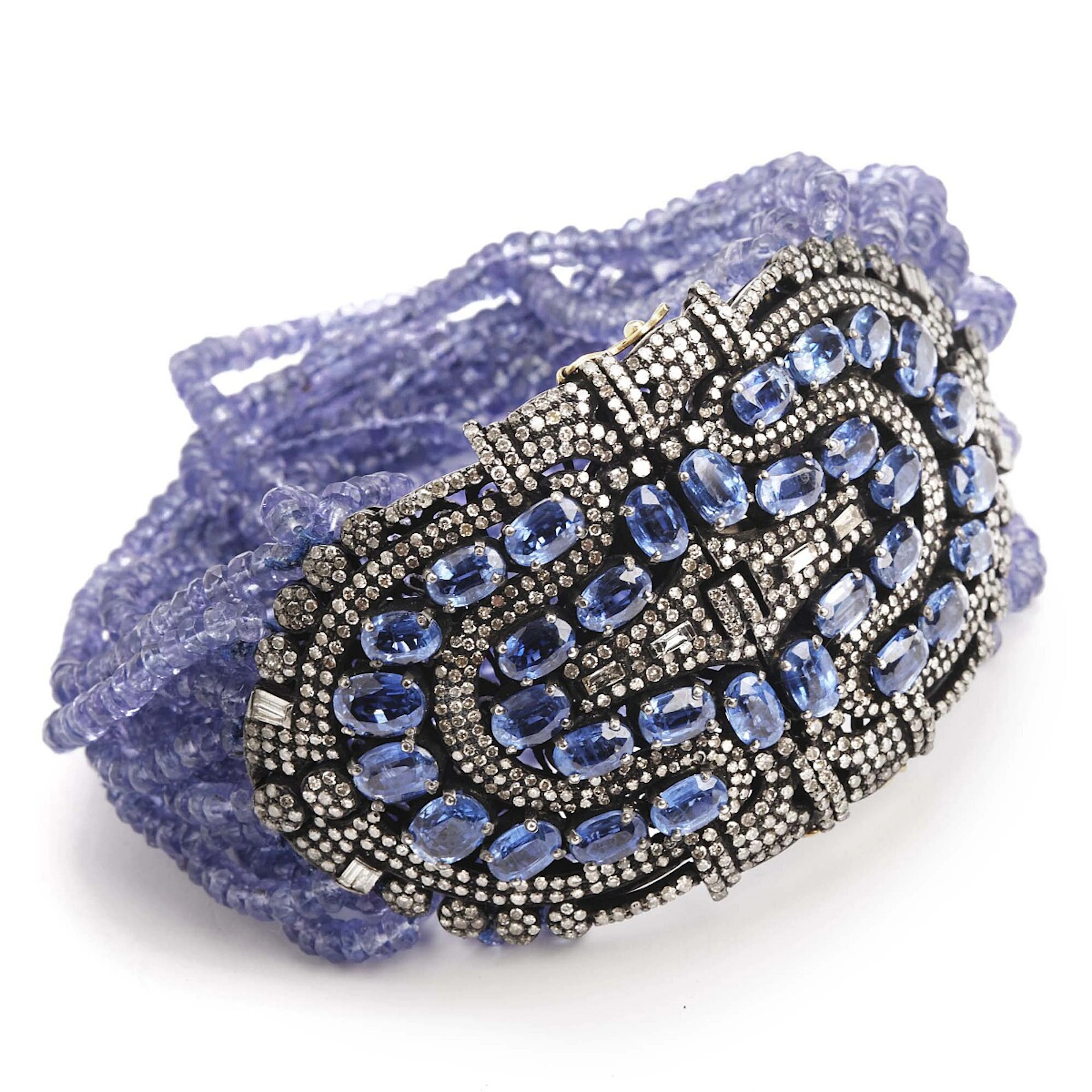 A tanzanite and diamond bracelet set with numerous pearls of tanzanite