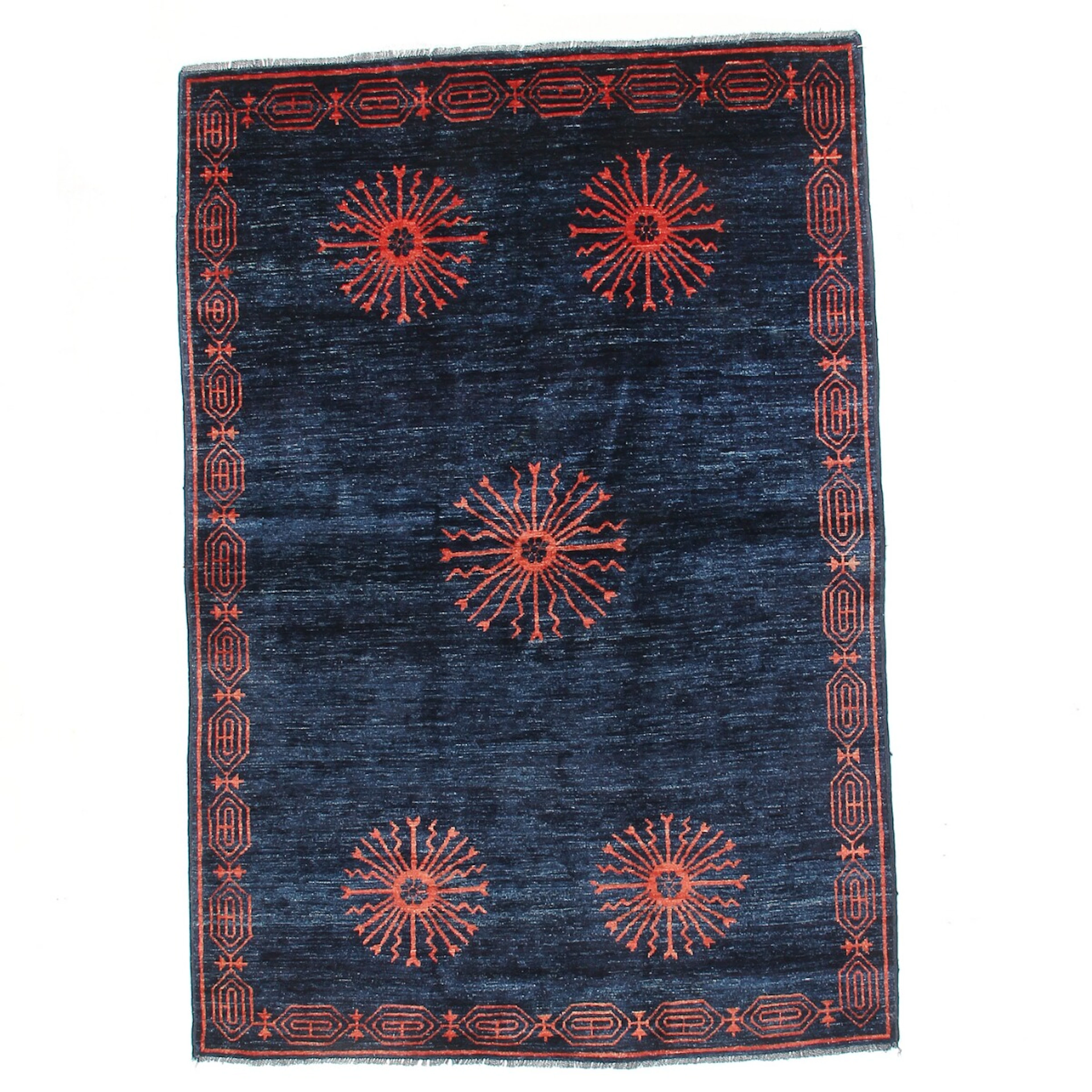 A Chinese/Nepali design carpet with sun motifs on a blue field