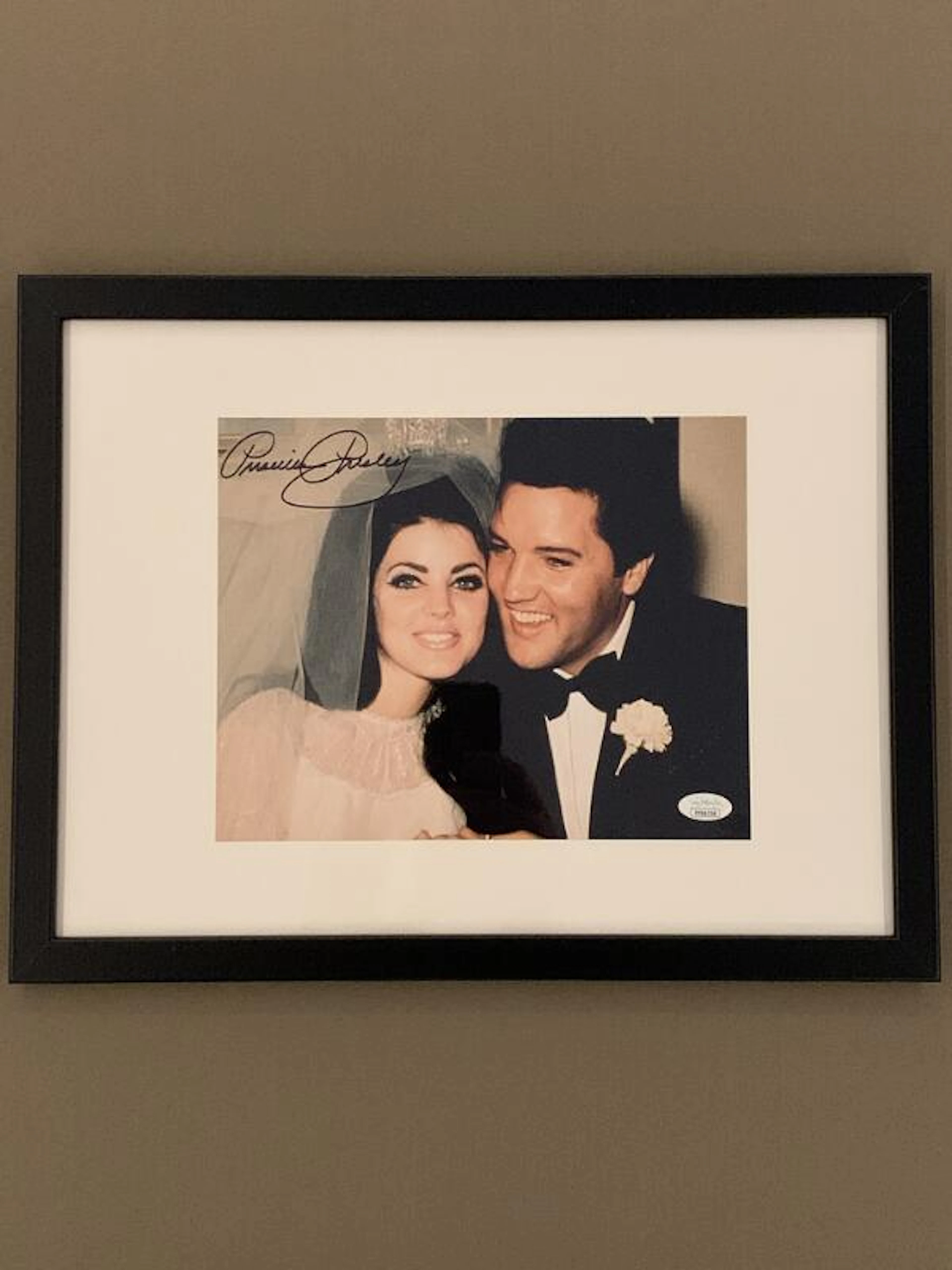 A signed colour photograph of the American actress Priscilla
