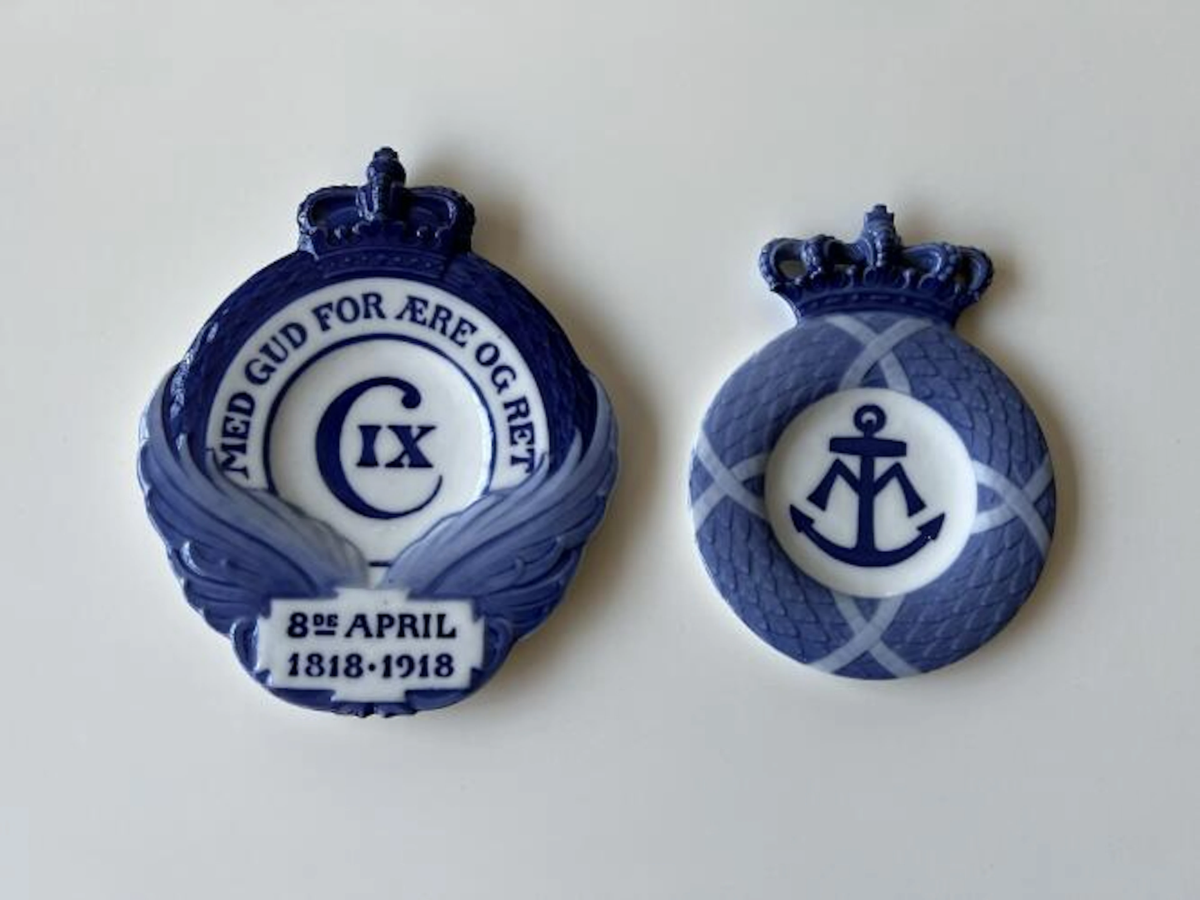 Two memorial porcelain plaquettes